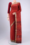 Rust Printed Silk Saree with Printed design on the body and Zari Border.  displayed on a mannequin