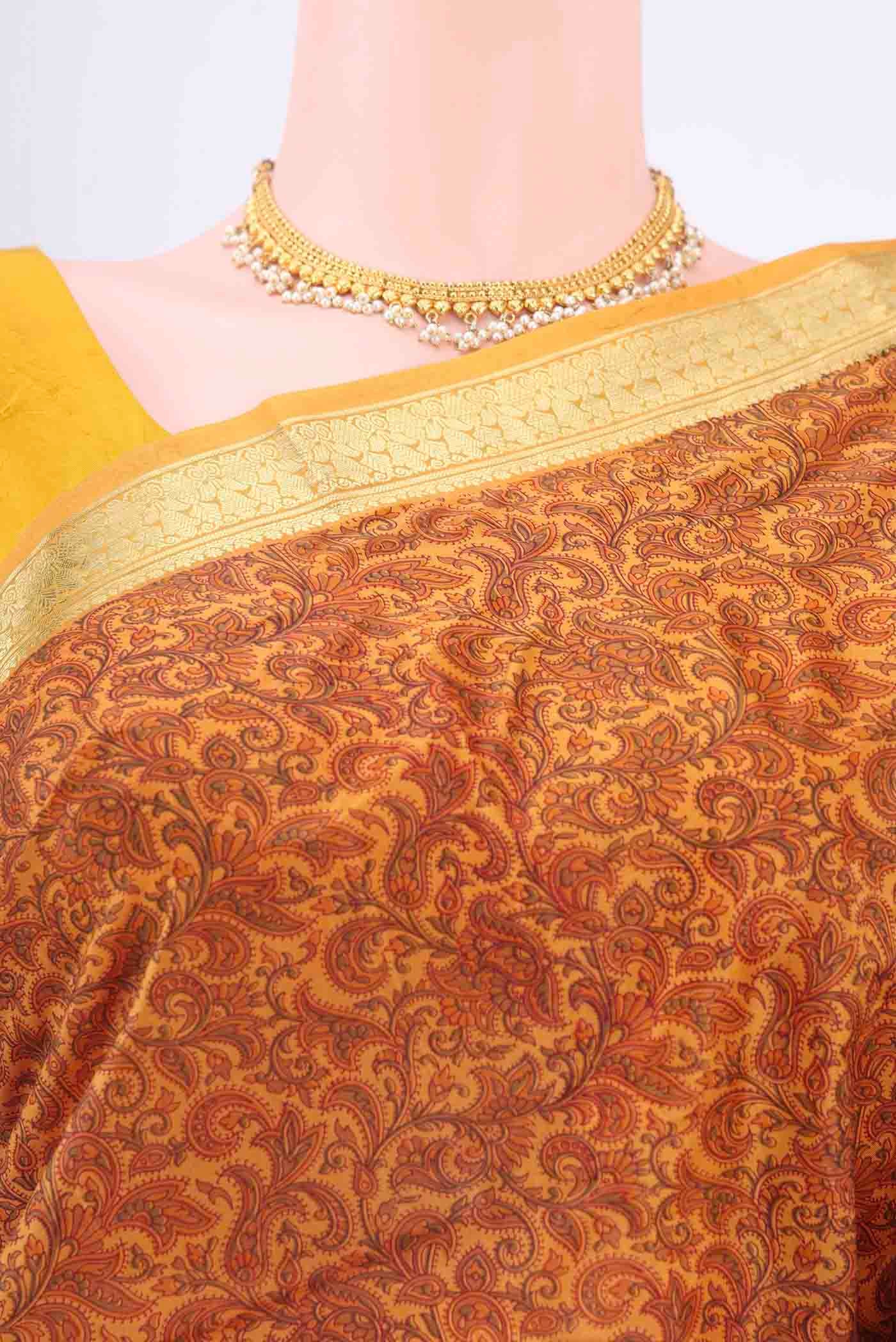 Border image of Mustard Printed Silk Saree with Floral Print on the body and Zari Border