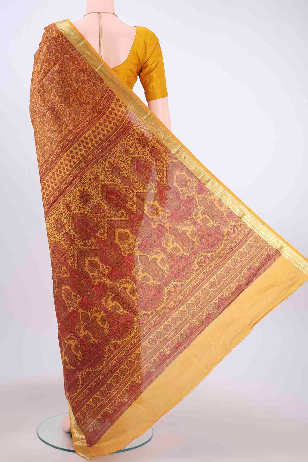 Flat view of Mustard Printed Silk Saree with Floral Print on the body and Zari Border