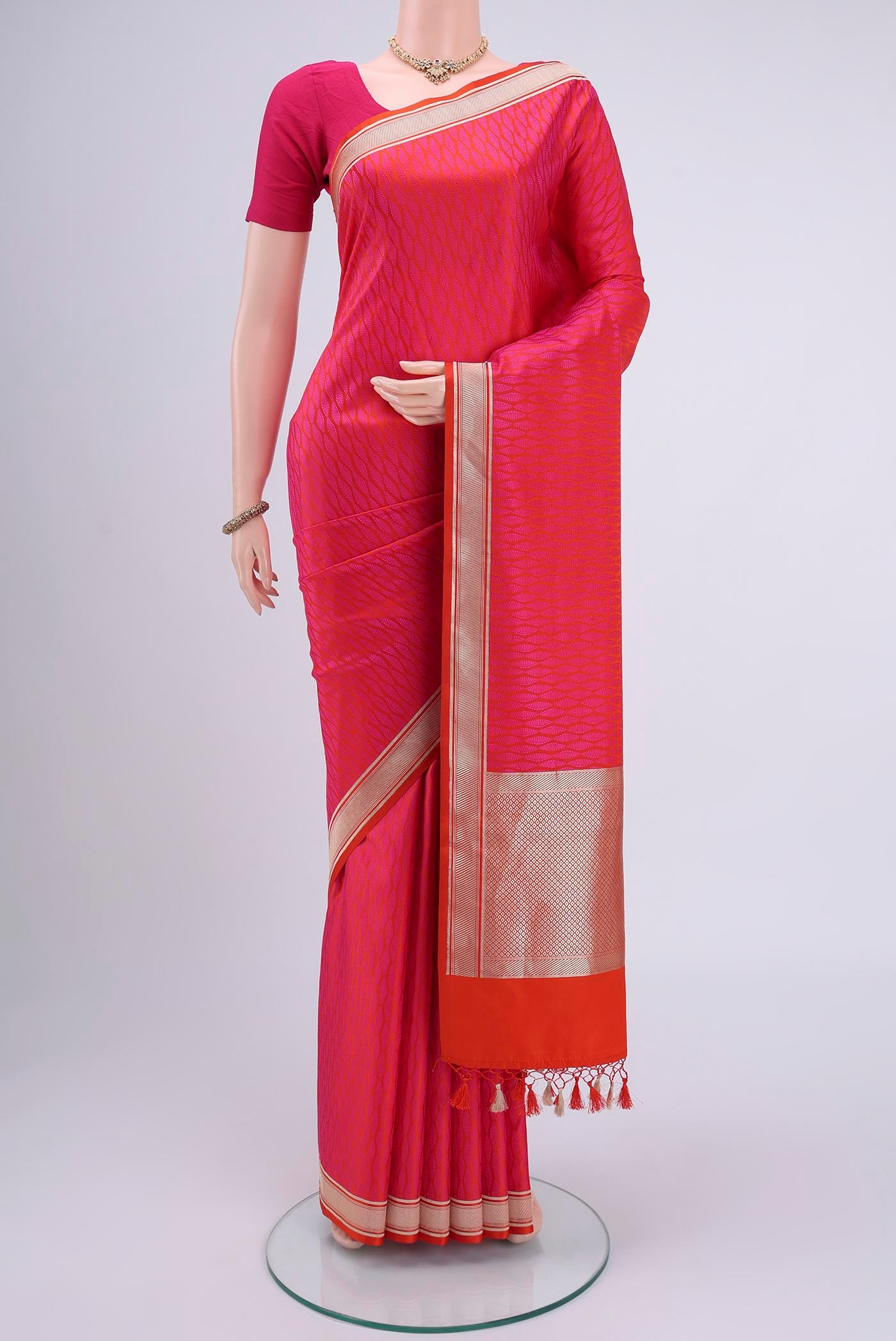 Pink Soft Silk Saree with Checked design on the body and Without Border.  displayed on a mannequin