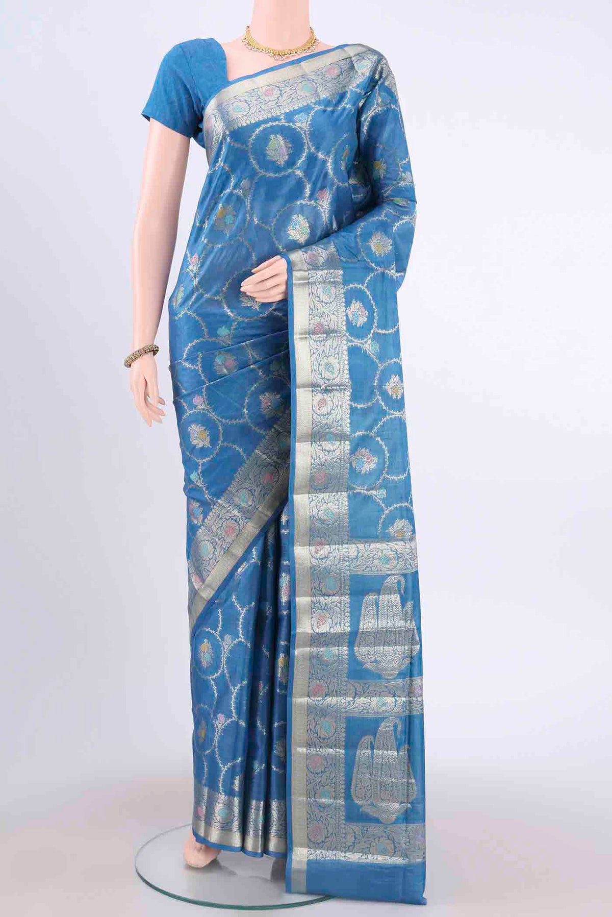 Blue Banarasi Tussar Silk Saree with Zari And Thread Butta on the body and Zari Border displayed on a mannequin
