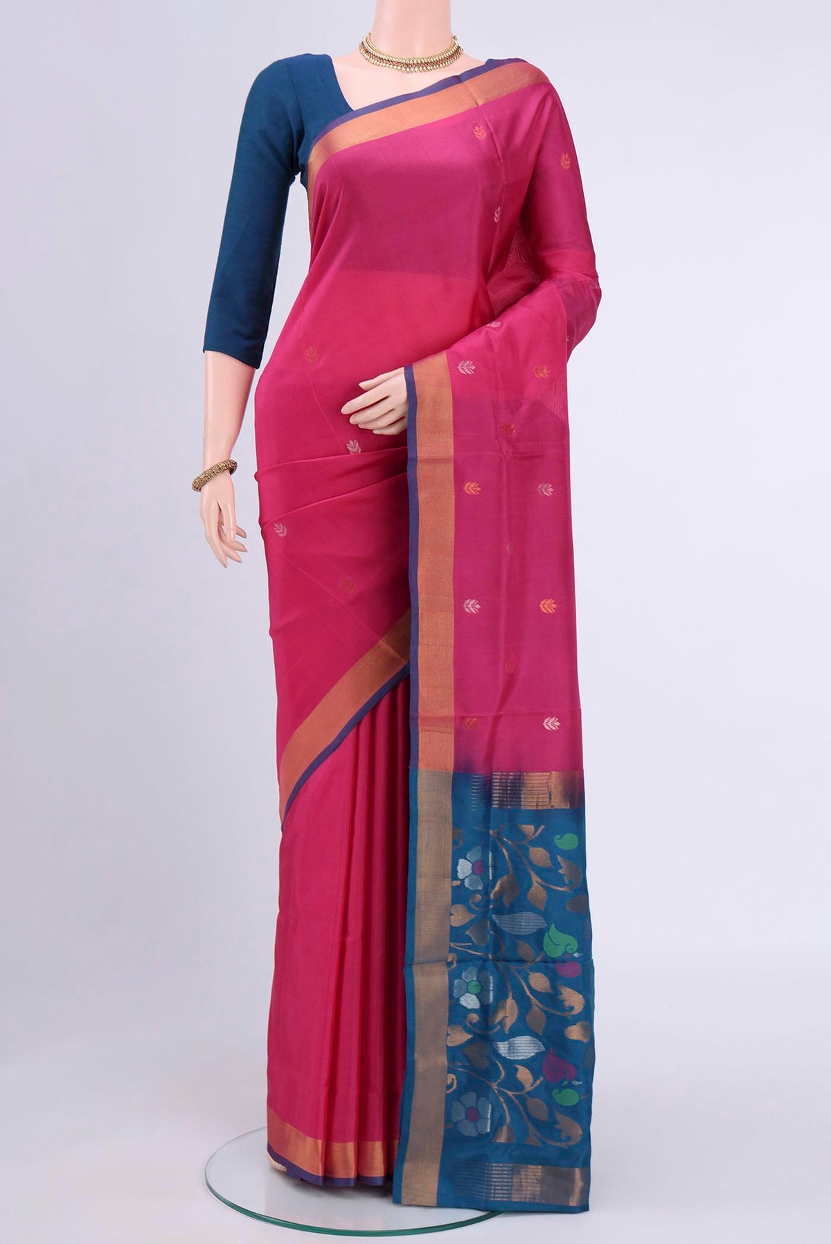 Pink Uppada Silk Saree with Zari Butta on the body and Zari Border displayed on a mannequin