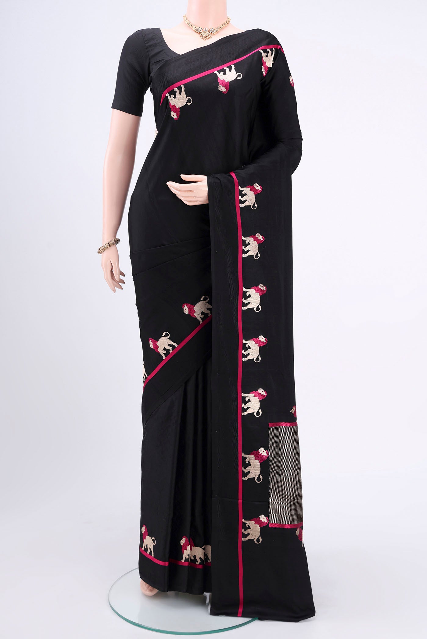 Black Banarasi Silk Saree with Plain Body and Zari And Thread Border.  displayed on a mannequin