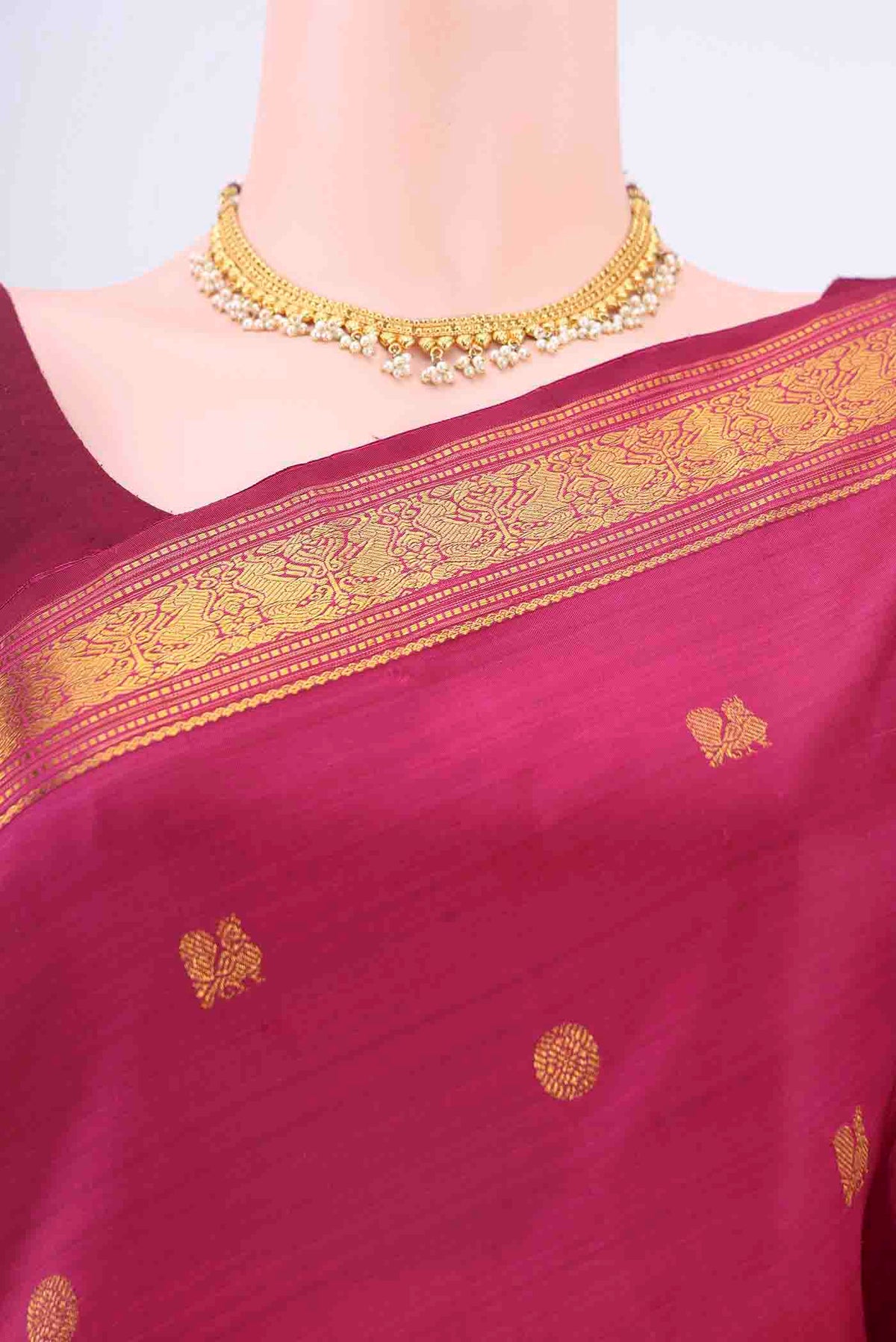 Border image of Maroon Kanchipuram Silk Saree with Zari Butta on the body and Zari Border