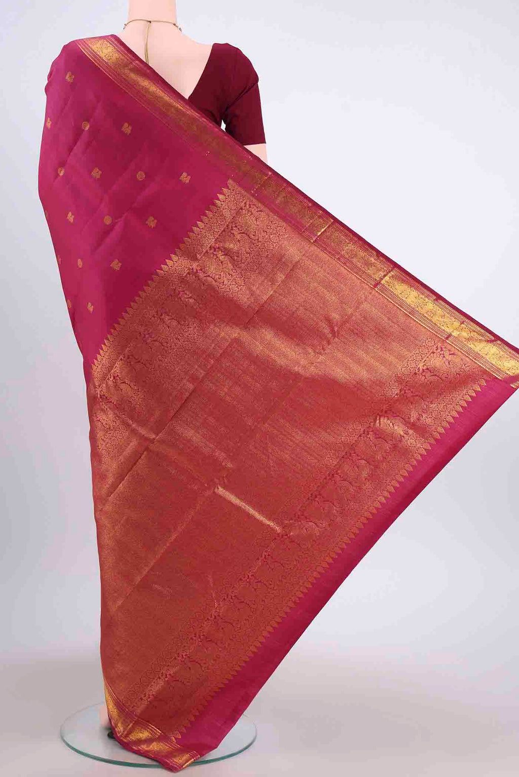 Flat view of Maroon Kanchipuram Silk Saree with Zari Butta on the body and Zari Border
