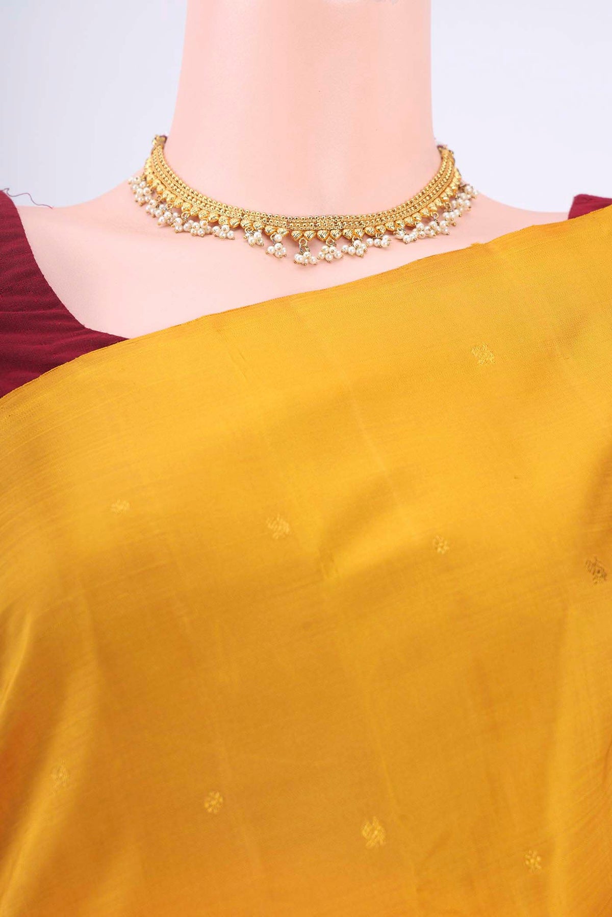 Border image of Mustard Kanchipuram Silk Saree with Zari Butta on the body and Without Border