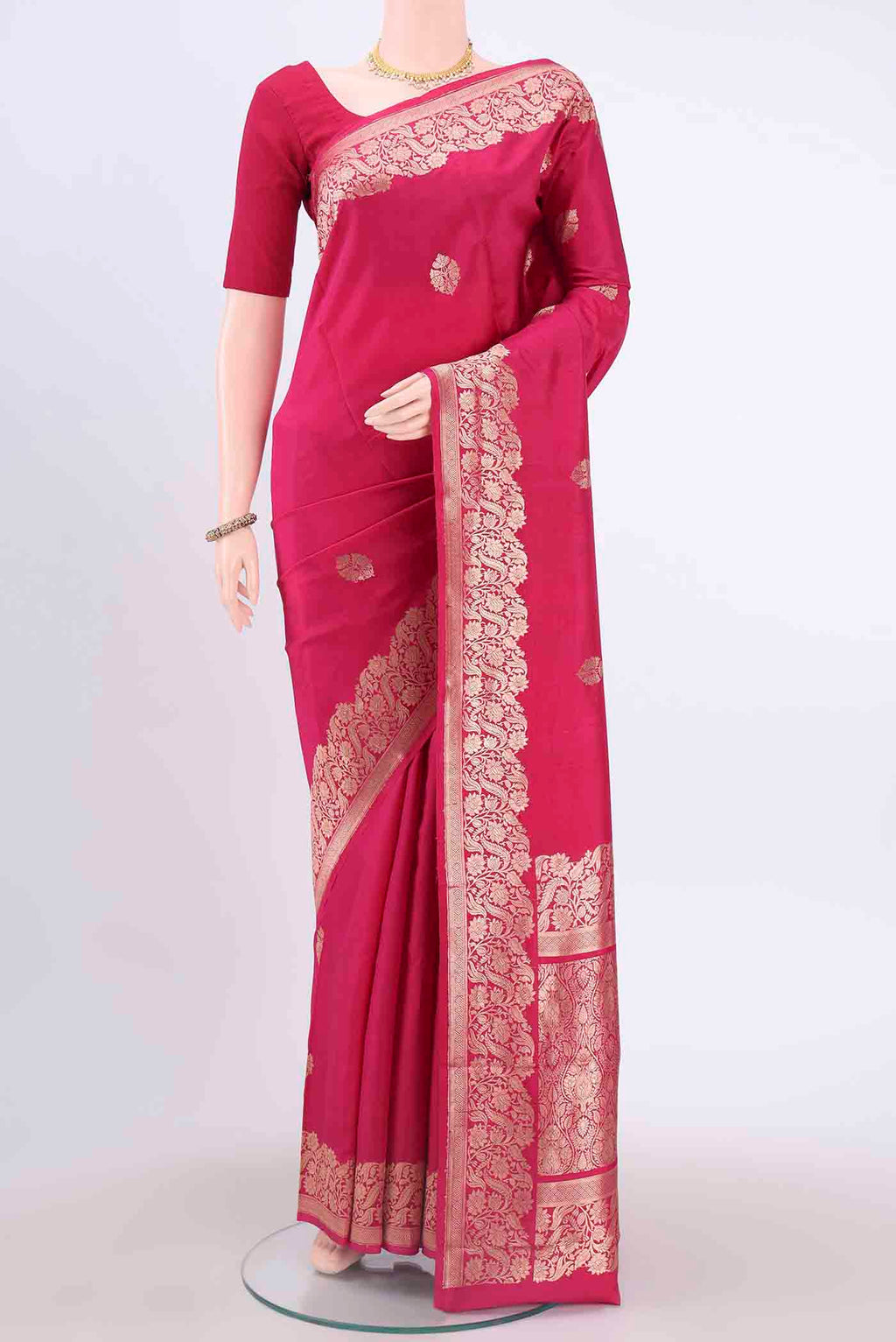 Rani Pink Dual Tone Banarasi Katan Silk Saree with Zari Butta on the body and Meenakari Border displayed on a mannequin