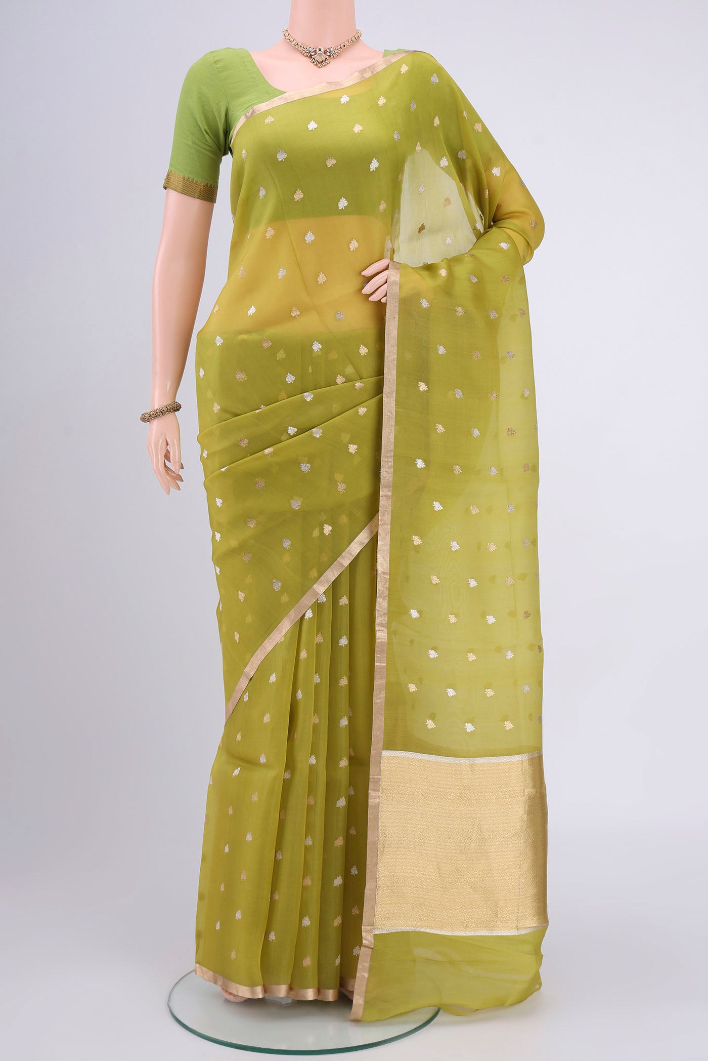 Acid Green Organza Silk Saree with Plain Body and Zari Border.  displayed on a mannequin
