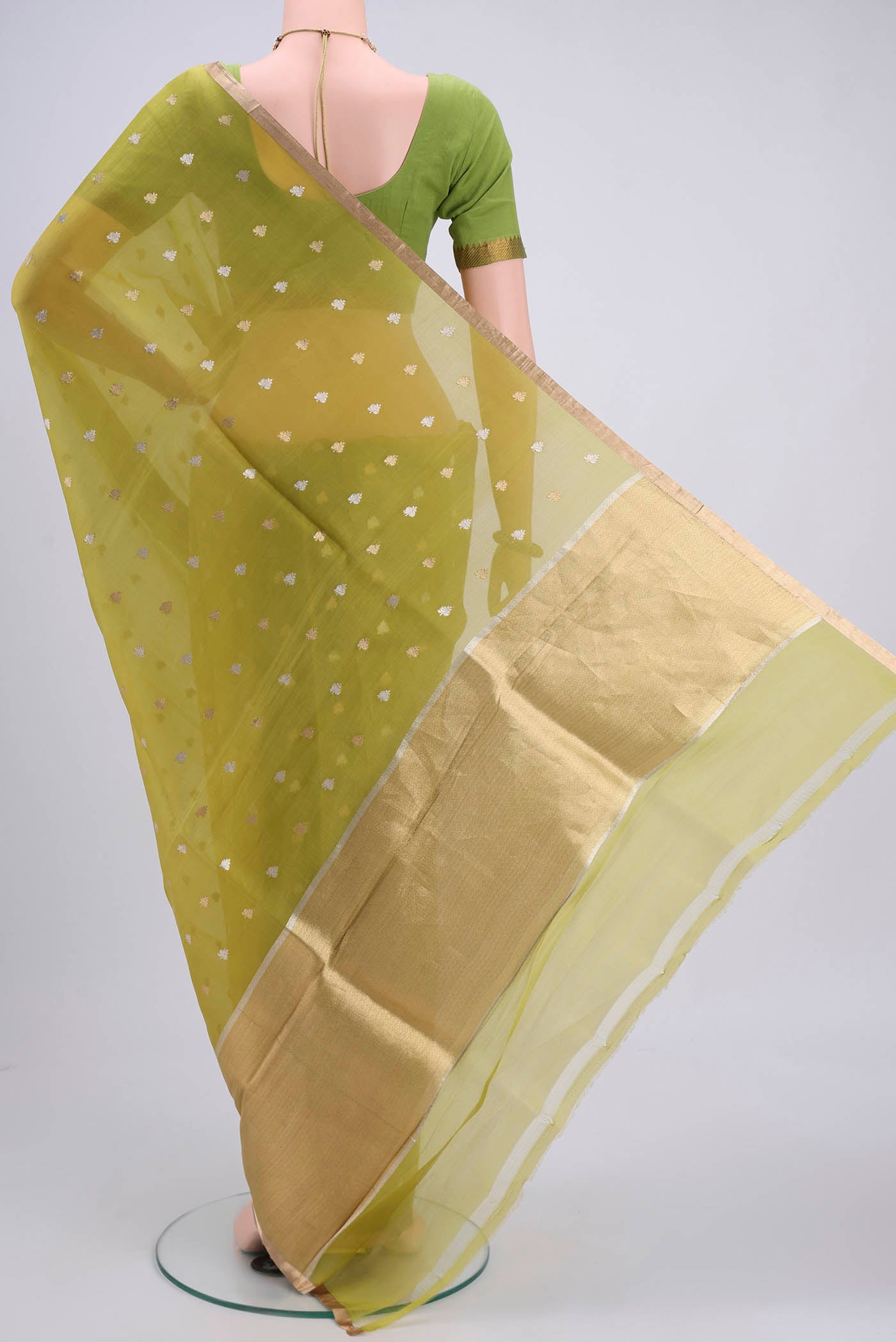 Flat view of Acid Green Organza Silk Saree with Plain Body and Zari Border. 