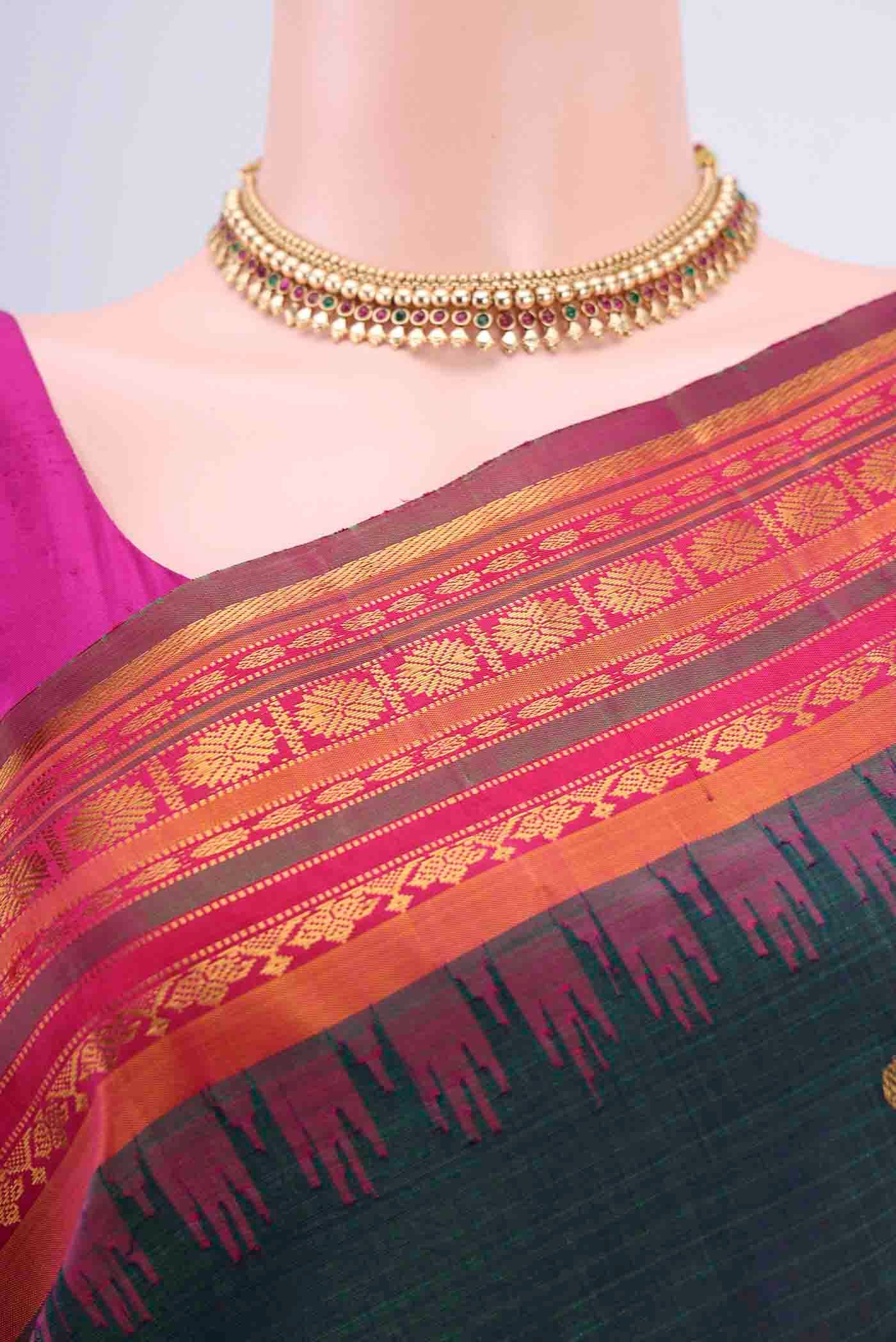 Border image of Bottle Green Gadwal Silk Saree with Zari Butta on the body and Zari Border
