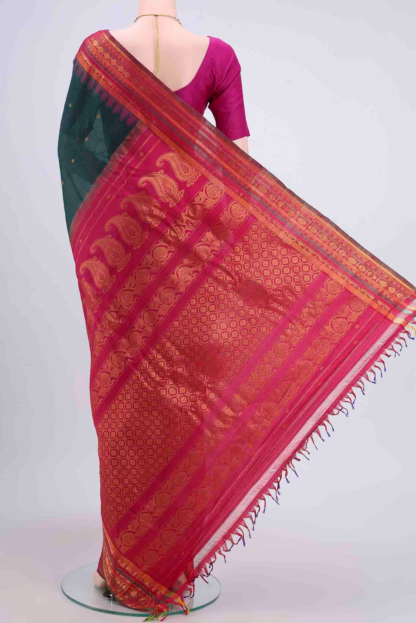 Flat view of Bottle Green Gadwal Silk Saree with Zari Butta on the body and Zari Border