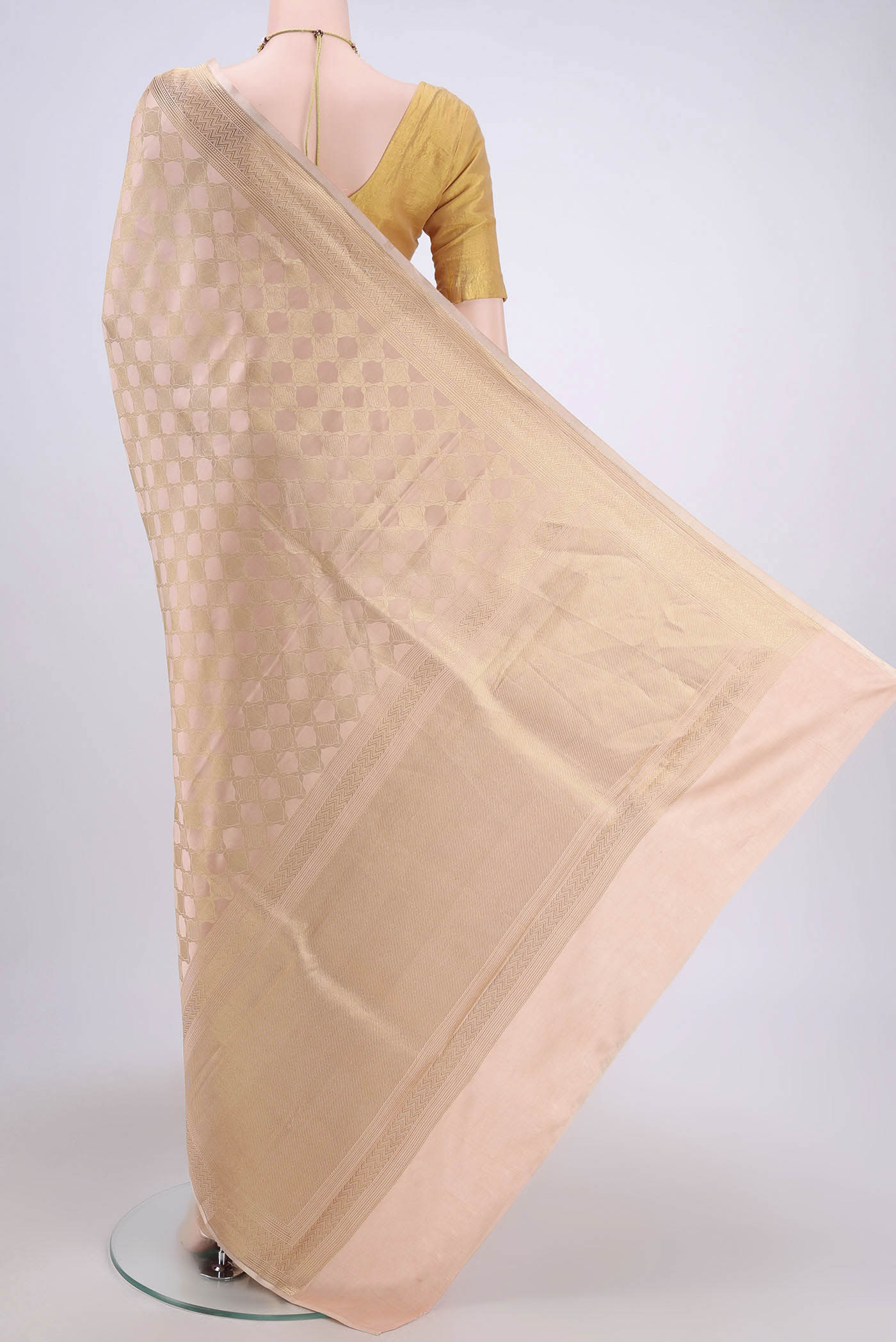 Flat view of Rose Gold Banarasi Katan Silk Saree with Zari Brocade on the body and Zari Border. 
