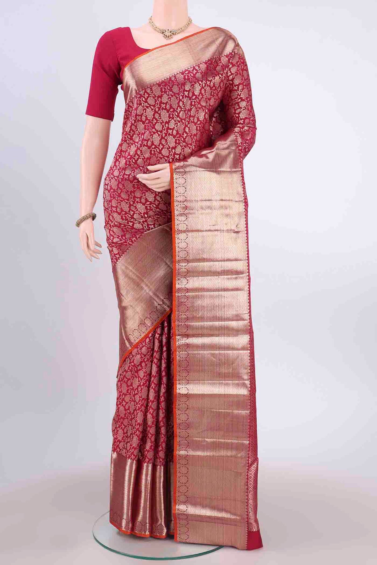 Maroon Kanchipuram Silk Saree with Zari Brocade on the body and Zari Border displayed on a mannequin