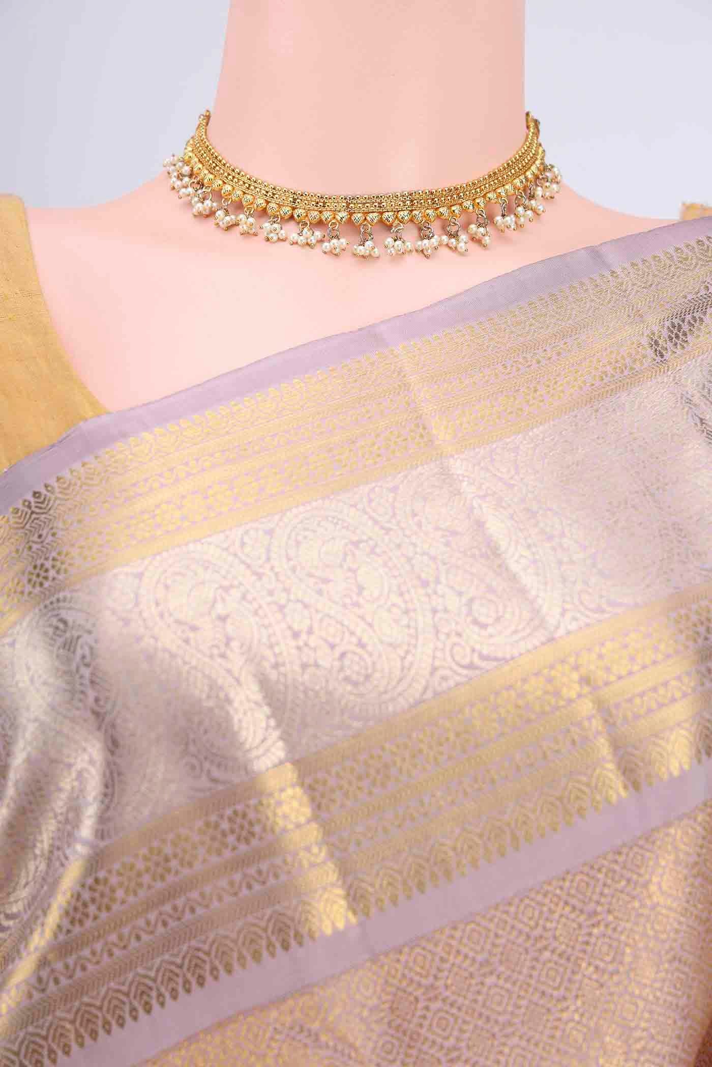 Border image of Mauve Kanchipuram Saree with Zari Brocade on the body and Zari Border