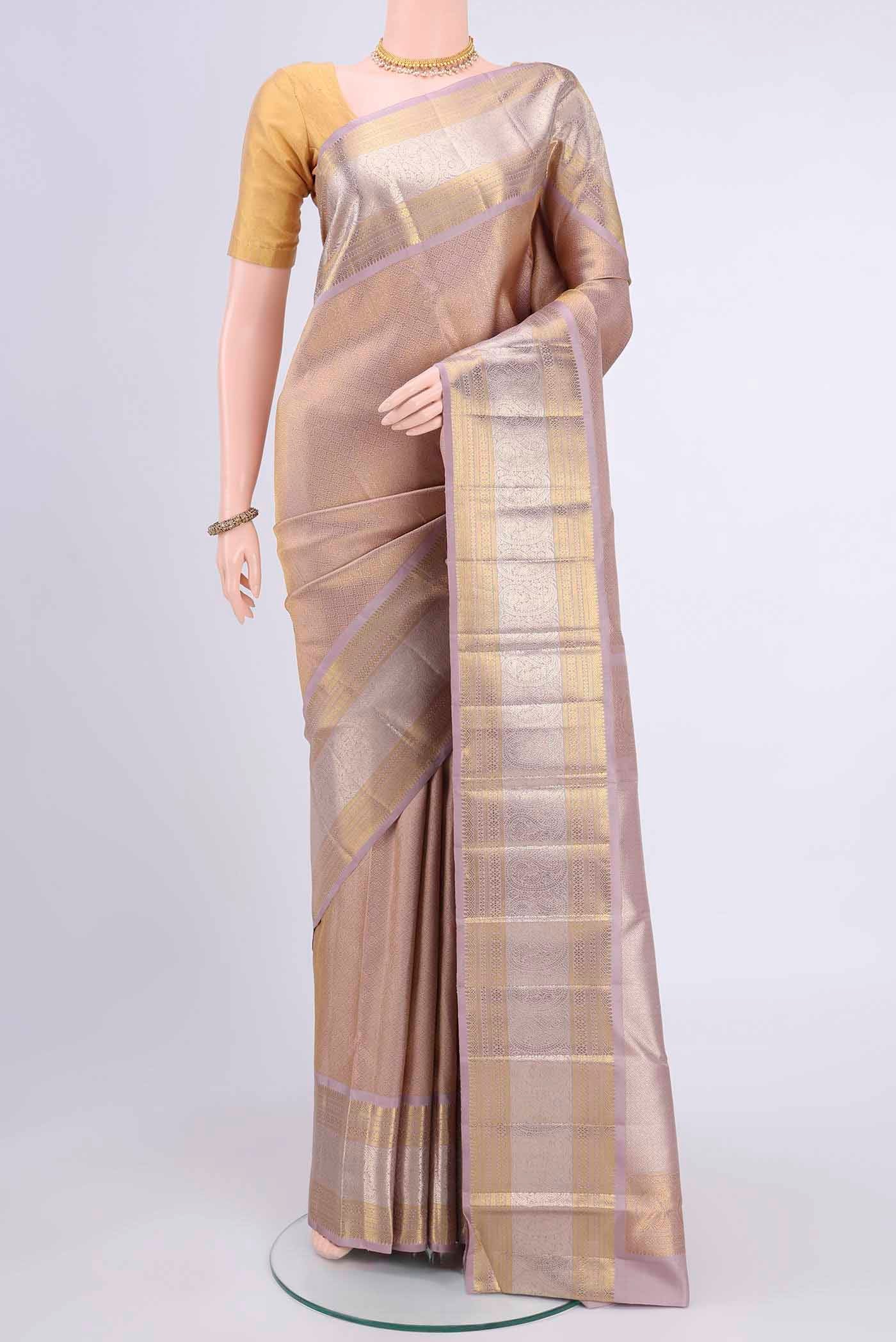 Mauve Kanchipuram Saree with Zari Brocade on the body and Zari Border displayed on a mannequin