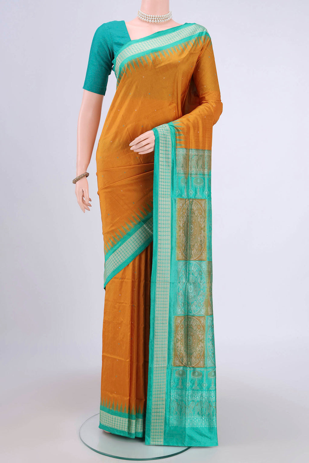 Mustard Orissa Silk Saree with Thread Butta on the body and Thread Border.  displayed on a mannequin