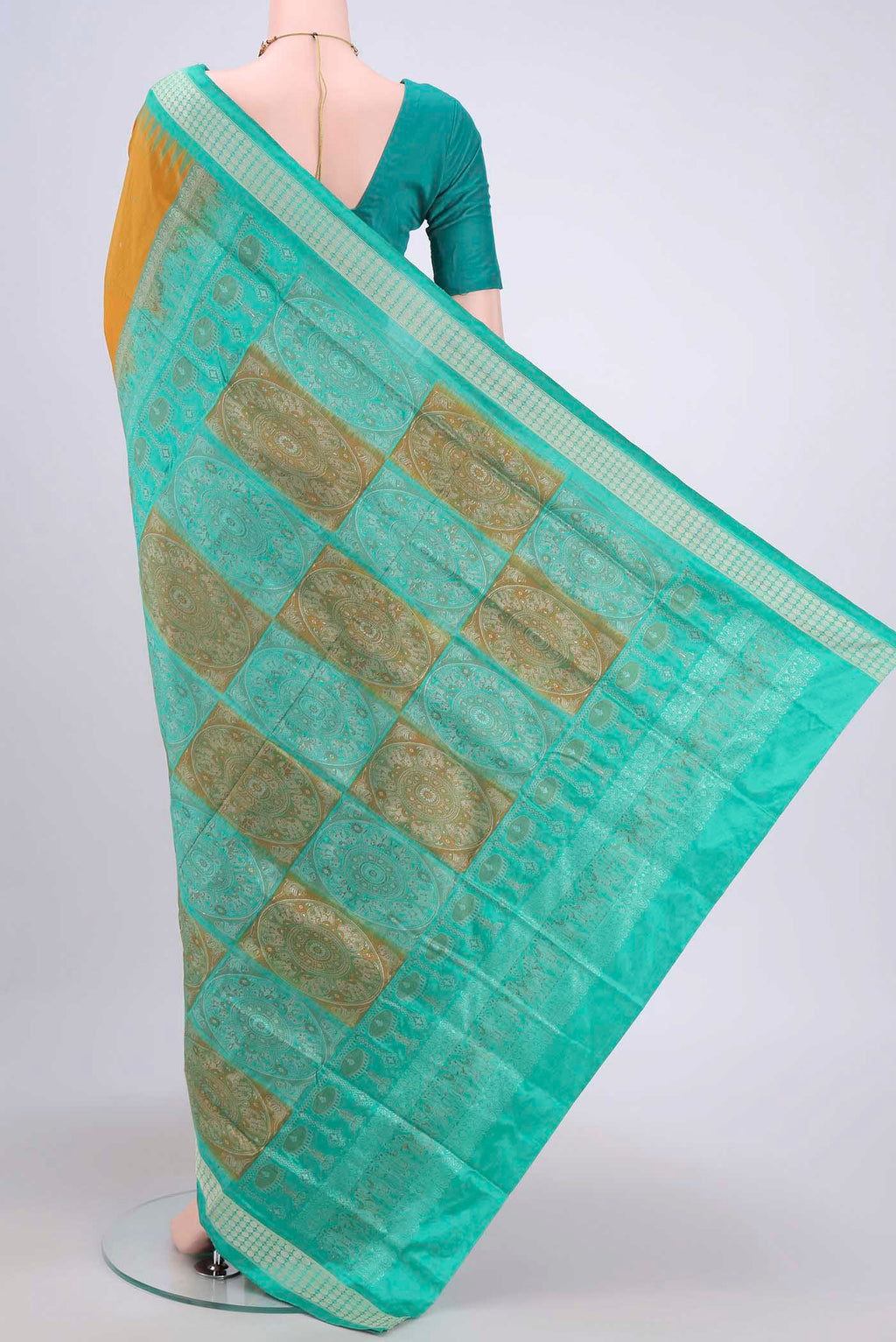 Flat view of Mustard Orissa Silk Saree with Thread Butta on the body and Thread Border. 