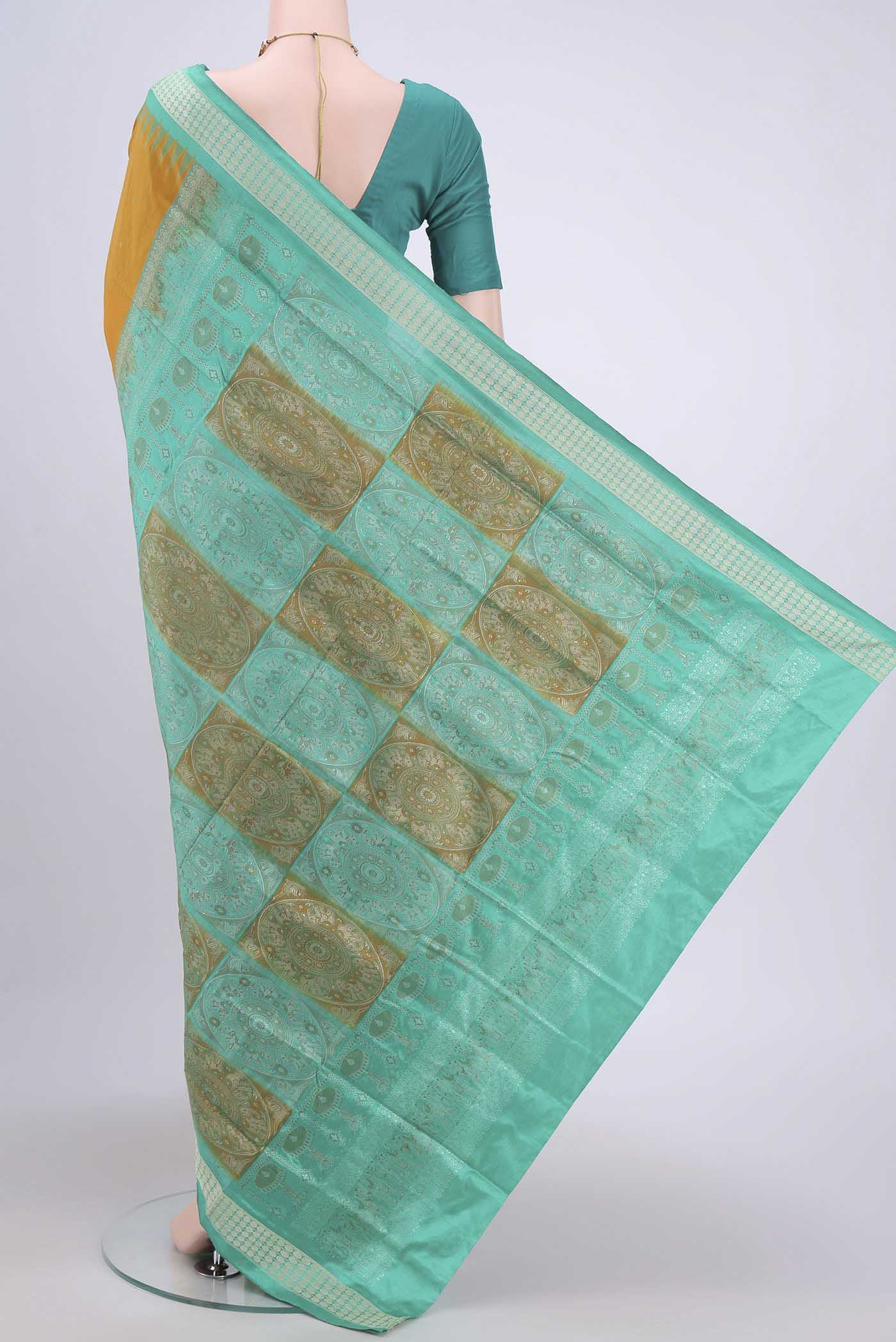Flat view of Mustard Orissa Silk Saree with Thread Butta on the body and Thread Border. 