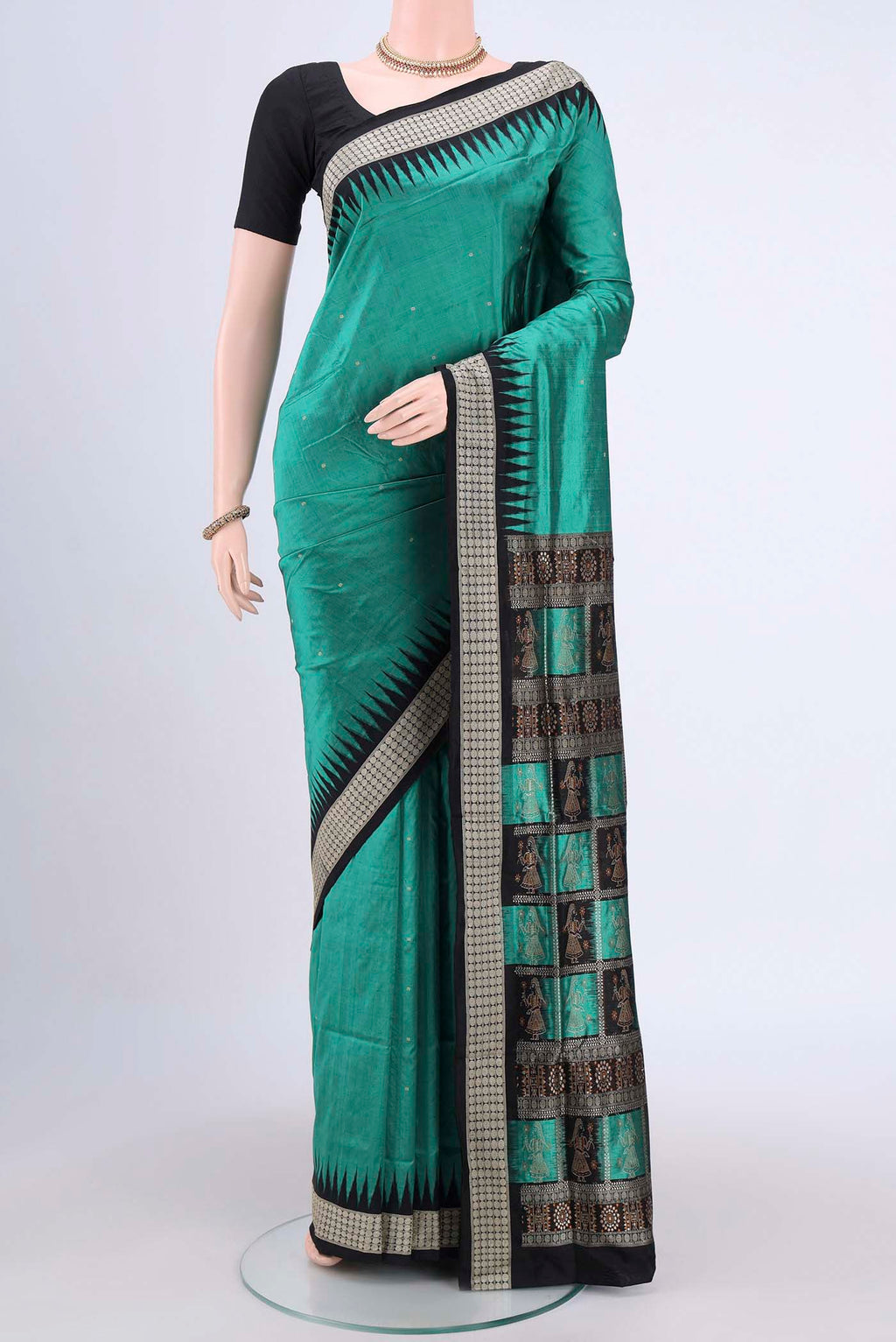 Sea Green Orissa Silk Saree with Thread Butta on the body and Temple Border.  displayed on a mannequin