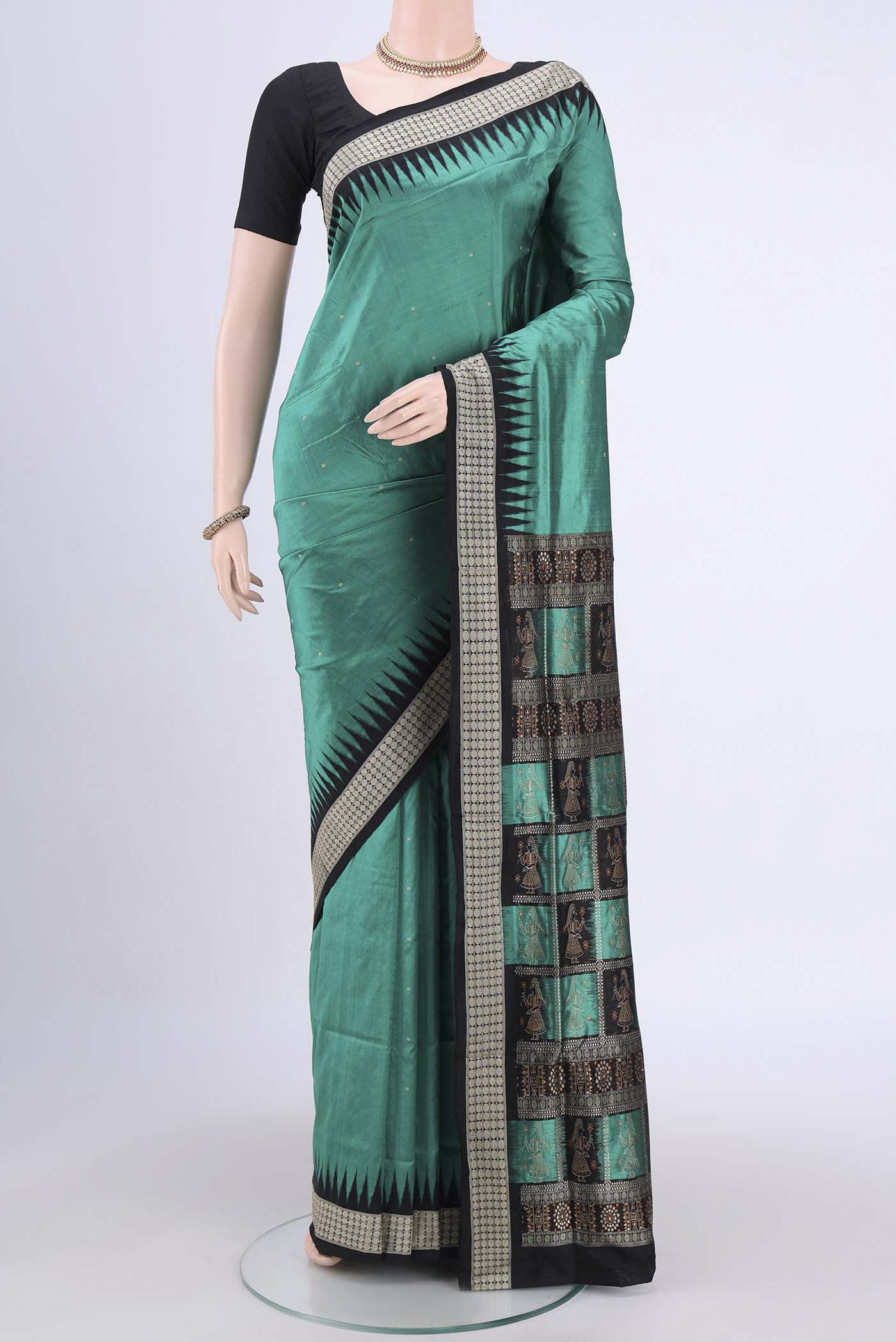 Sea Green Orissa Silk Saree with Thread Butta on the body and Temple Border.  displayed on a mannequin