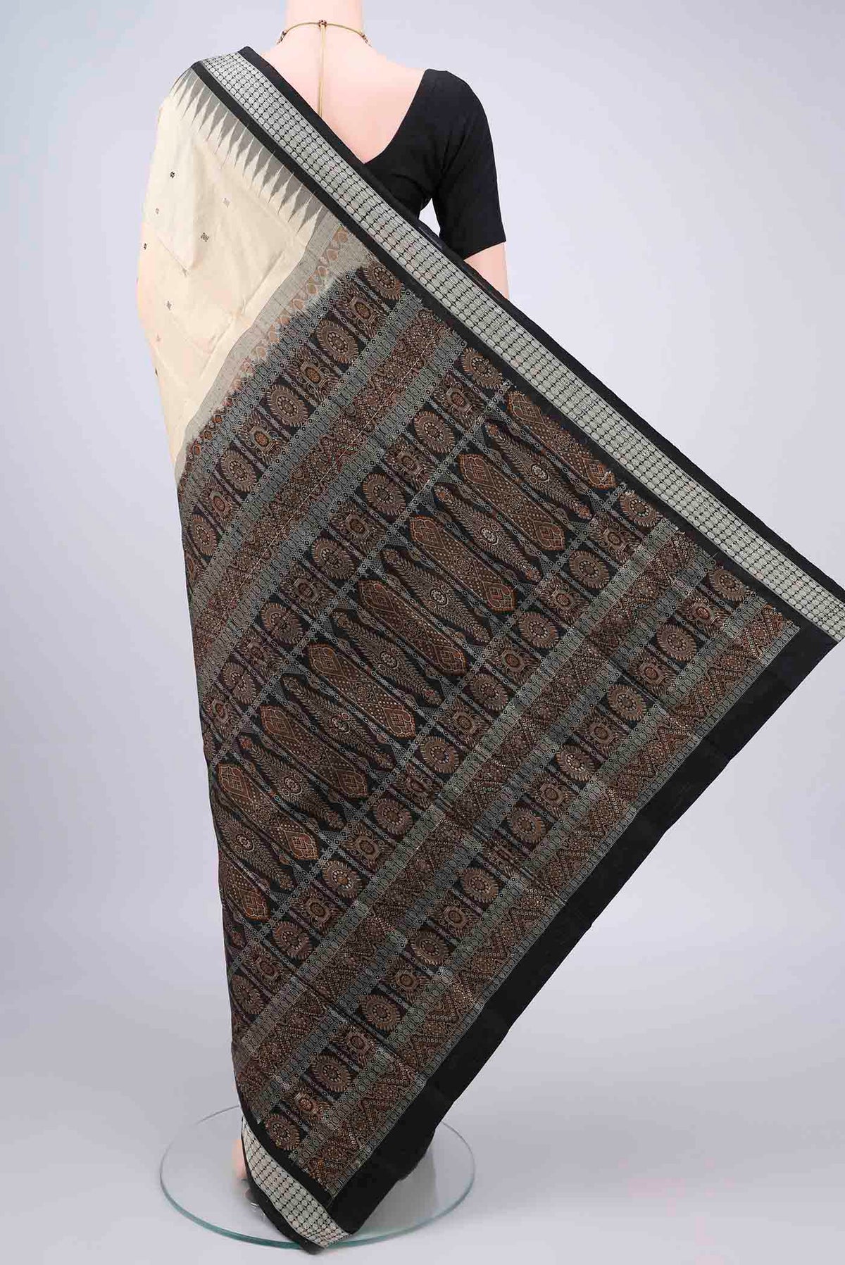 Flat view of Pure Silk Cream Orissa Saree with Thread Butta on the body and Thread Border. 