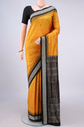 Pure Silk Mustard Orissa Saree with Thread Butta on the body and Thread Border.  displayed on a mannequin