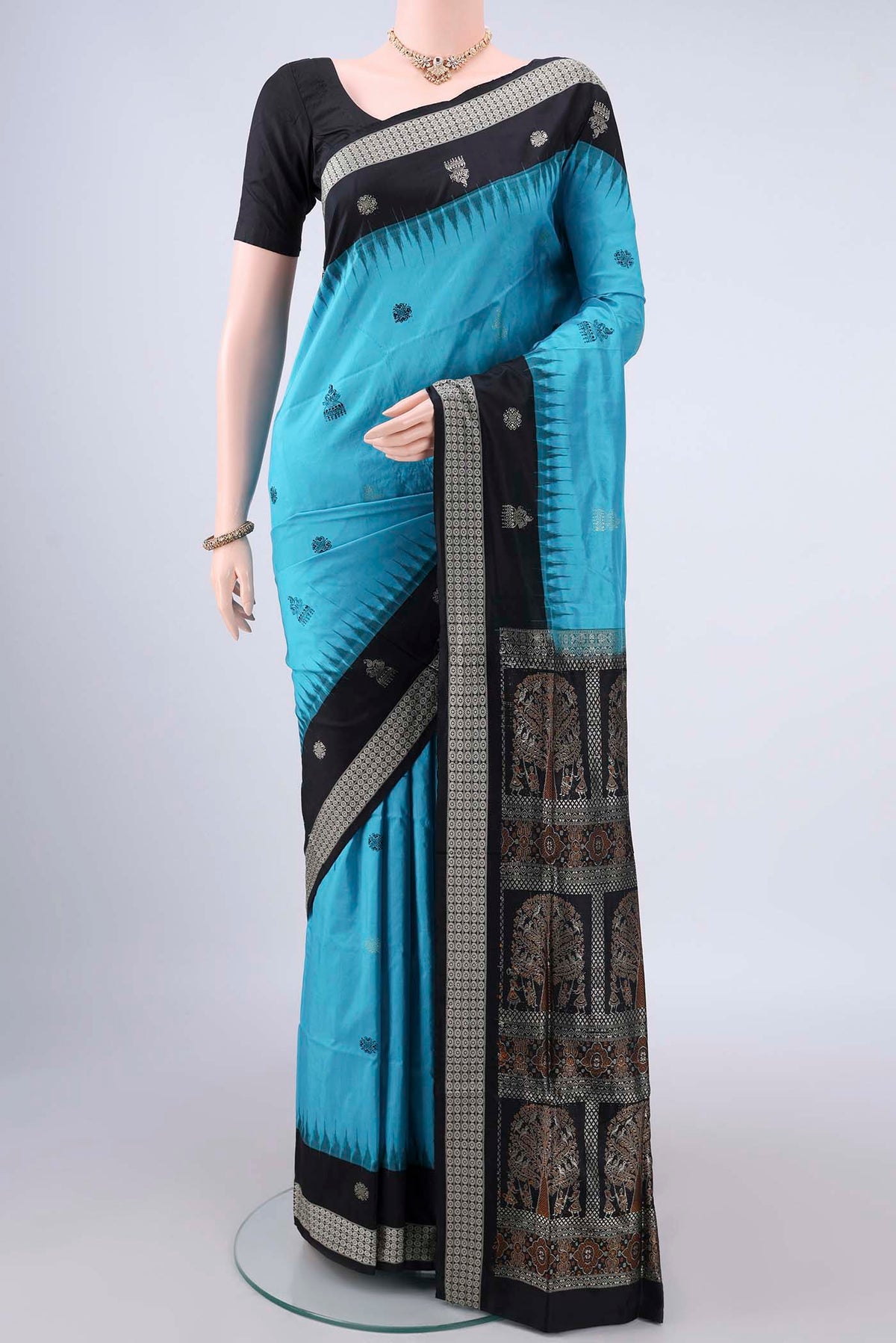 Pure Silk Turquoise Orissa Saree with Thread Butta on the body and Thread Border.  displayed on a mannequin