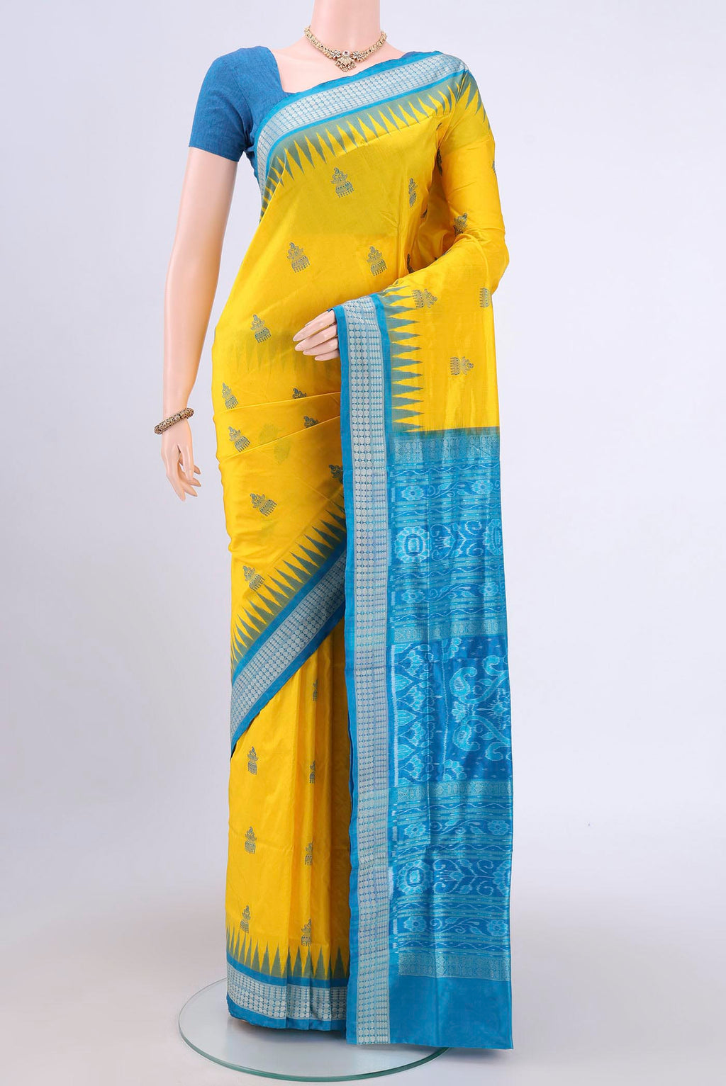 Yellow Orissa Silk Saree with Thread Butta on the body and Thread Border.  displayed on a mannequin