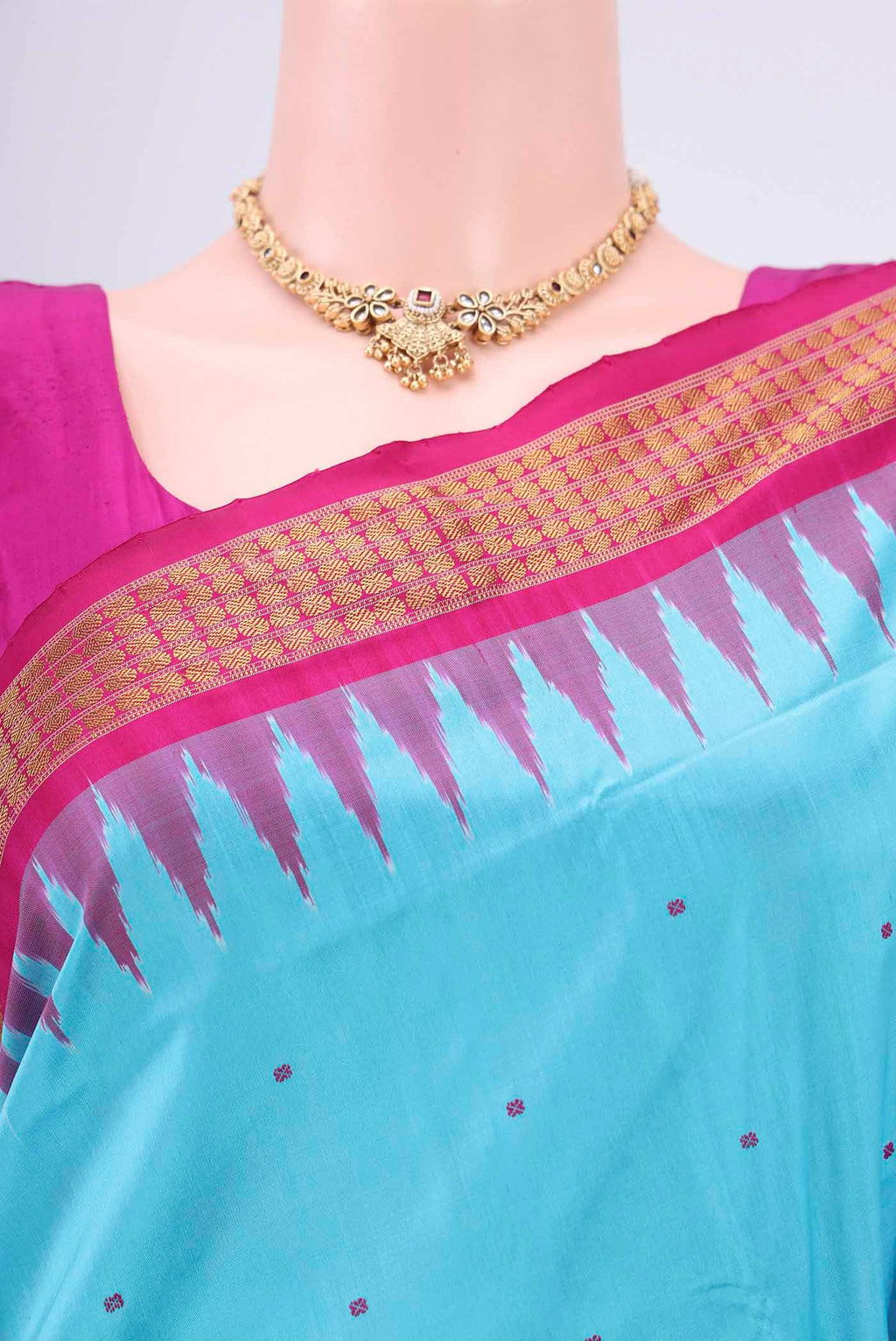Border image of Turquoise Orissa Silk Saree with Thread Butta on the body and Zari Border. 