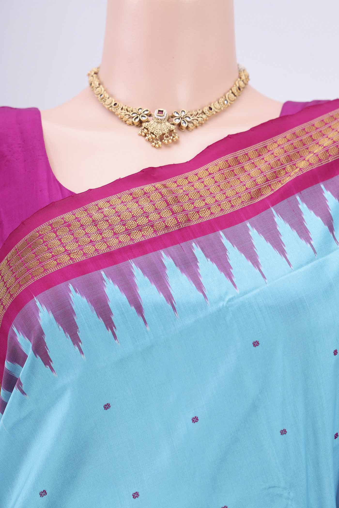 Border image of Turquoise Orissa Silk Saree with Thread Butta on the body and Zari Border. 
