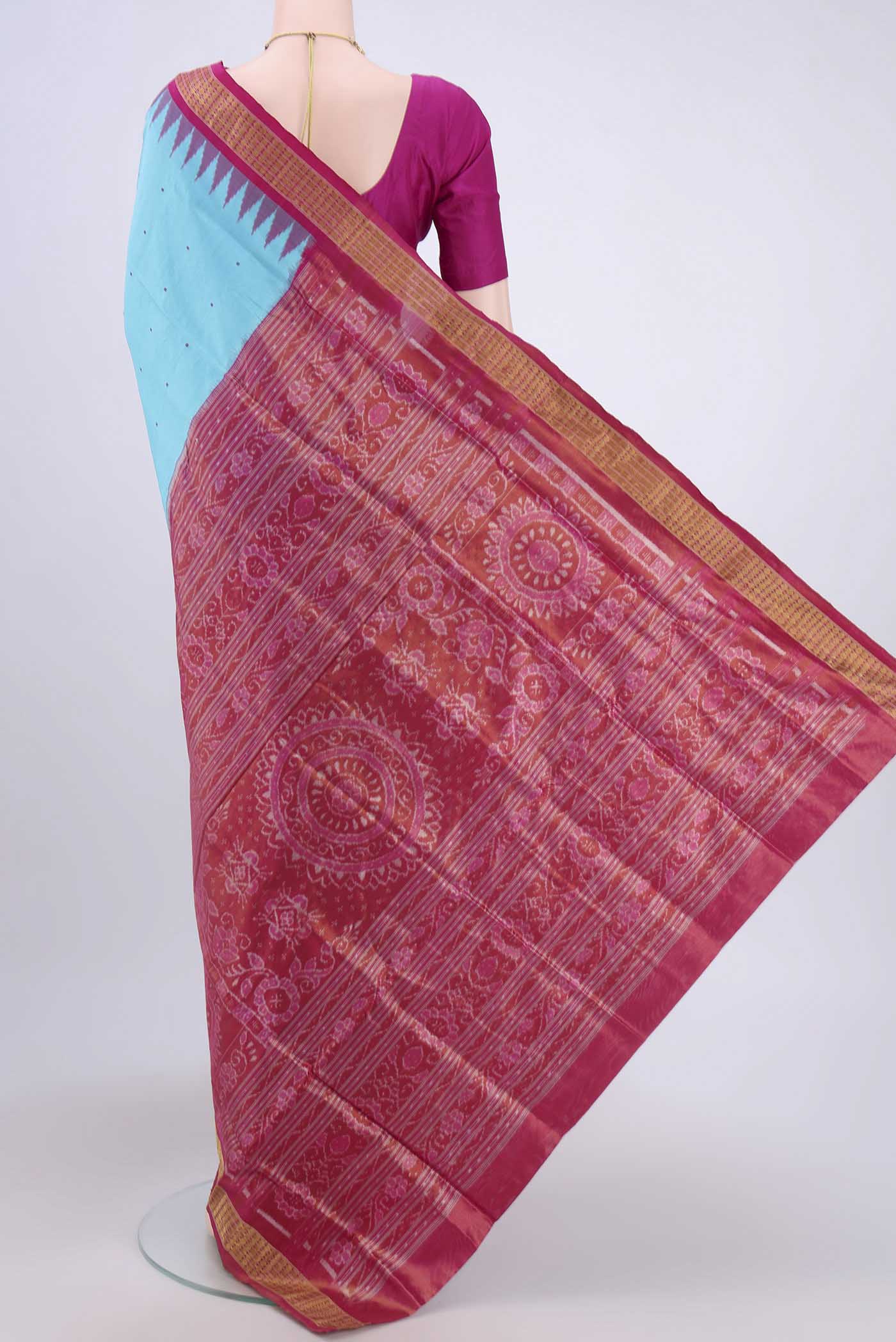 Flat view of Turquoise Orissa Silk Saree with Thread Butta on the body and Zari Border. 