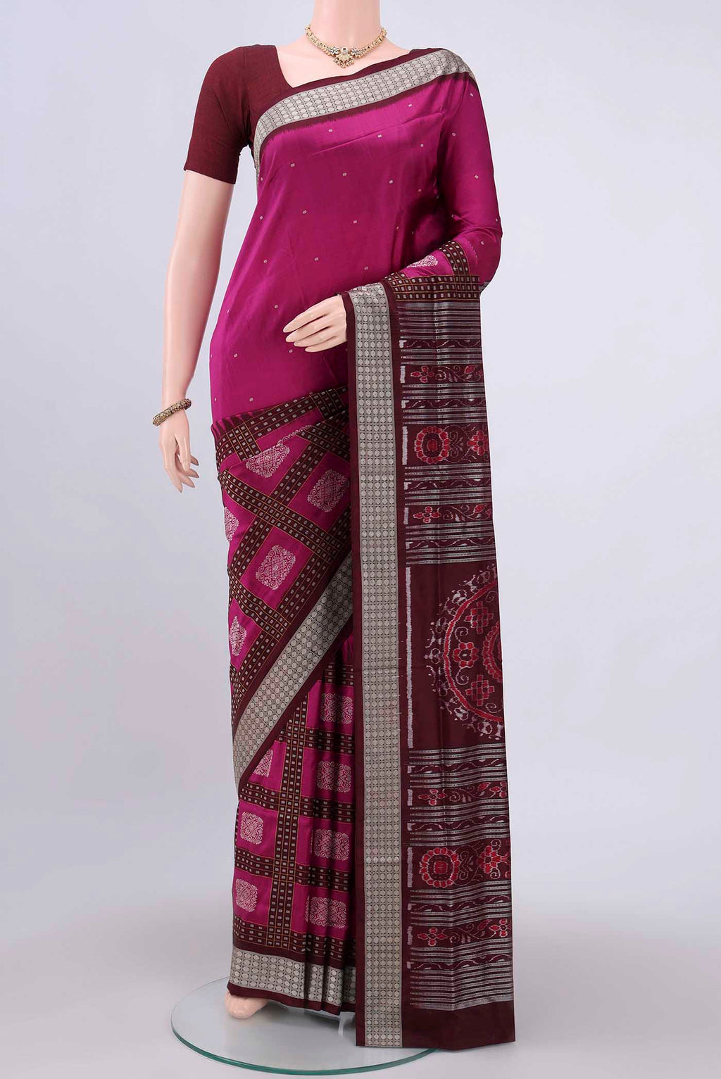 Magenta Orissa Silk Saree with Thread Butta on the body and Thread Border.  displayed on a mannequin