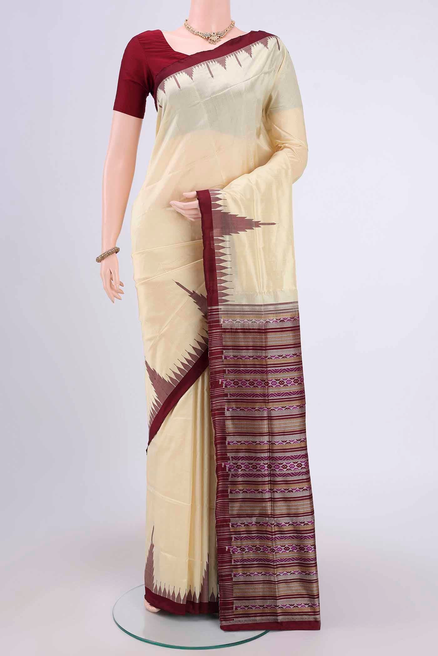 Cream Orissa Silk Saree with Plain Body and Temple Border.  displayed on a mannequin