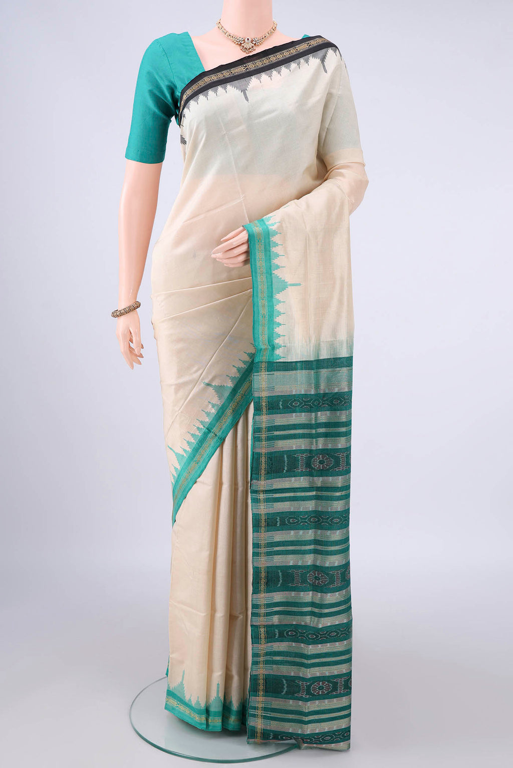 Pure Silk Off White Orissa Saree with Plain Body and Ganga Jamuna Border.  displayed on a mannequin