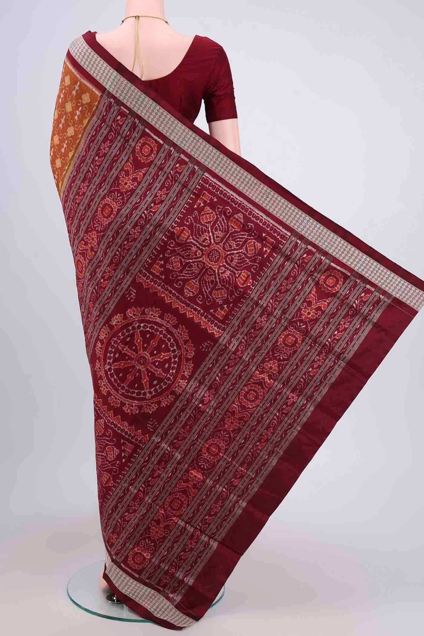 Flat view of Brown Orissa Silk Saree with Ikat design on the body and Thread Border. 