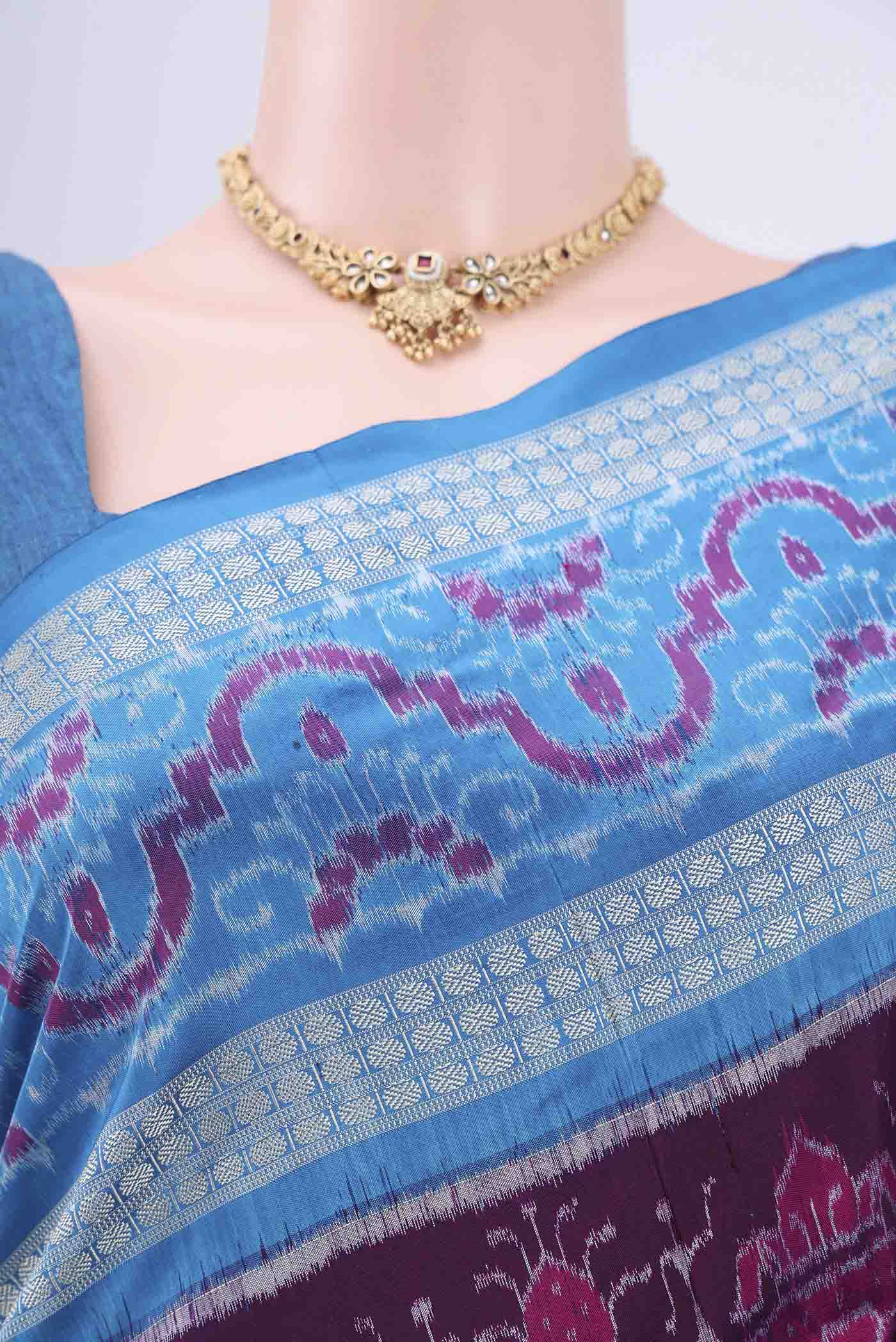 Border image of Purple Orissa Silk Saree with Ikat design on the body and Thread Border. 