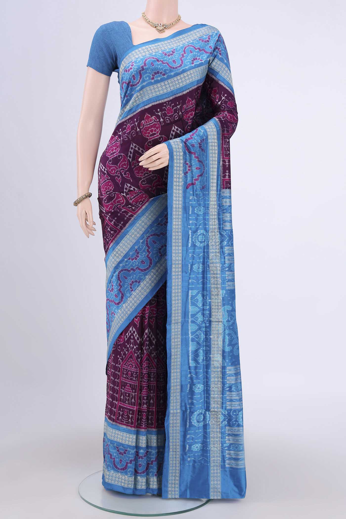 Purple Orissa Silk Saree with Ikat design on the body and Thread Border.  displayed on a mannequin