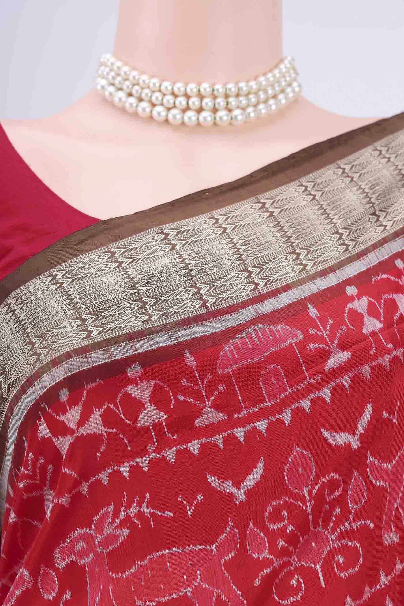Border image of Deep Red Orissa Silk Saree with Ikat design on the body and Thread Border. 