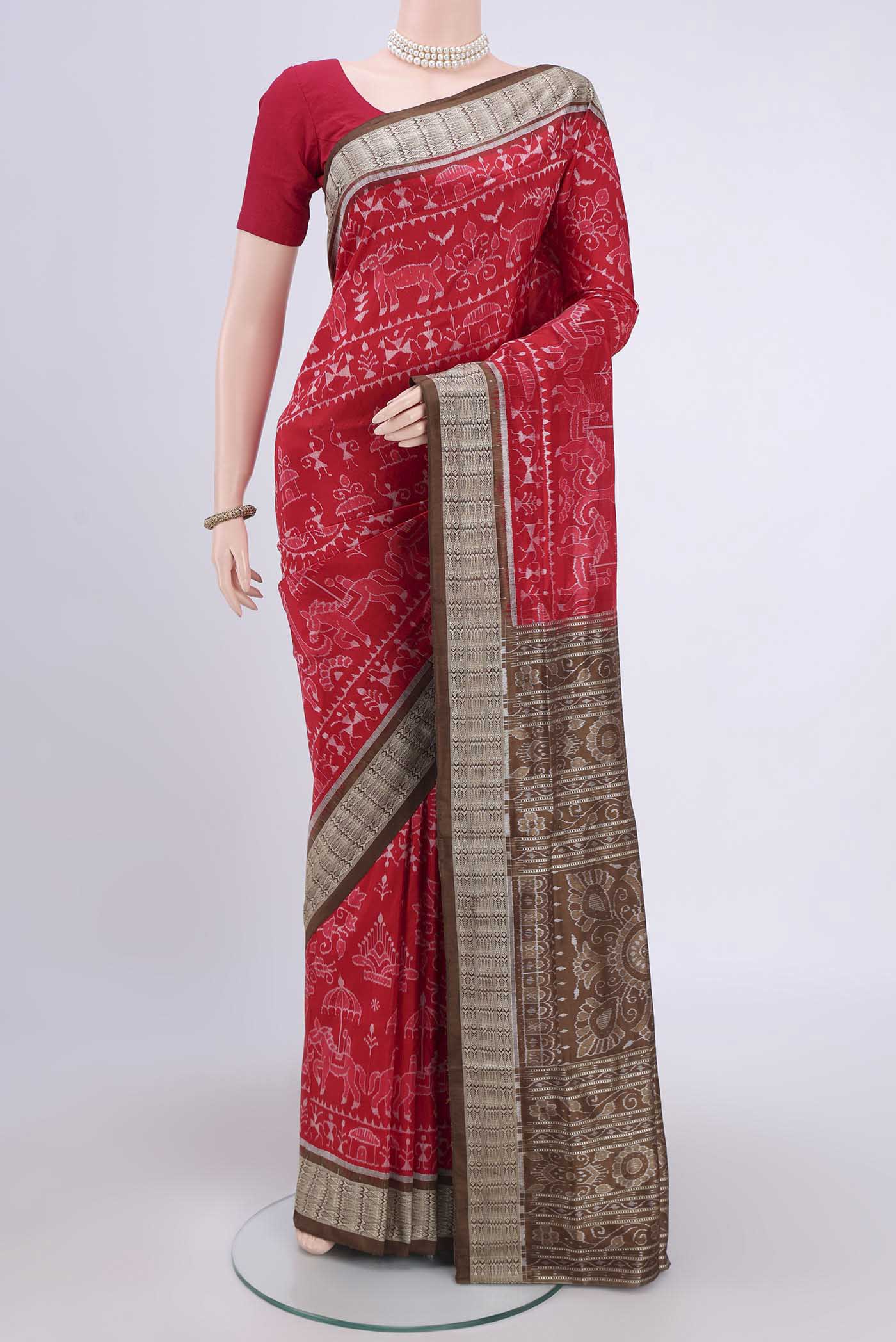 Deep Red Orissa Silk Saree with Ikat design on the body and Thread Border.  displayed on a mannequin