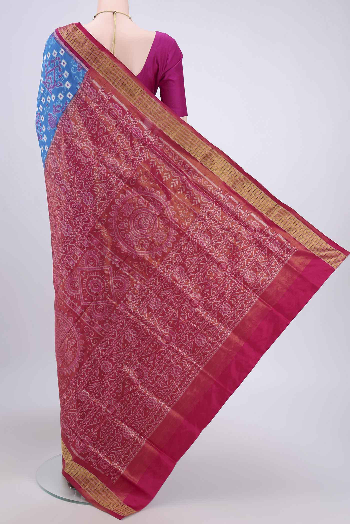 Flat view of Blue Orissa Silk Saree with Ikat design on the body and Thread Border. 