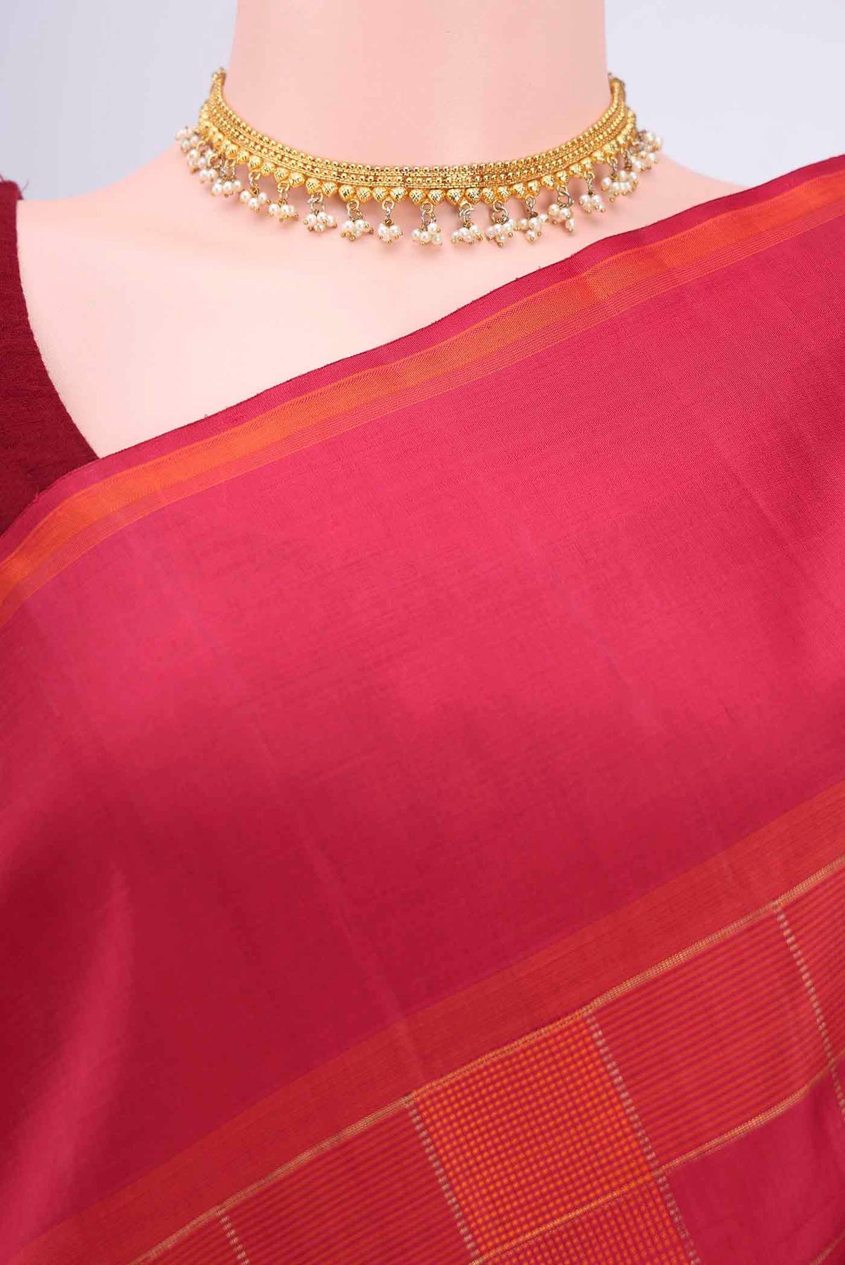 Border image of Maroon Dual Tone Kanchipuram Silk Saree with Checked design on the body and Zari Border