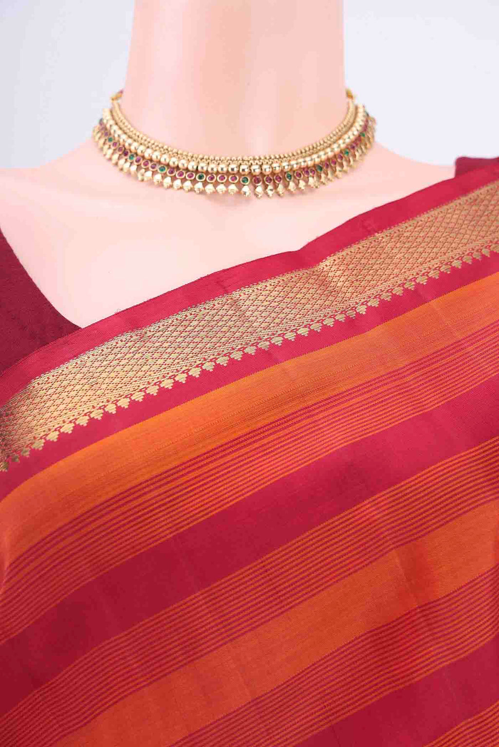 Border image of Pure Silk Pure Zari Rust Kanchipuram Saree with Stripes on the body and Plain Border