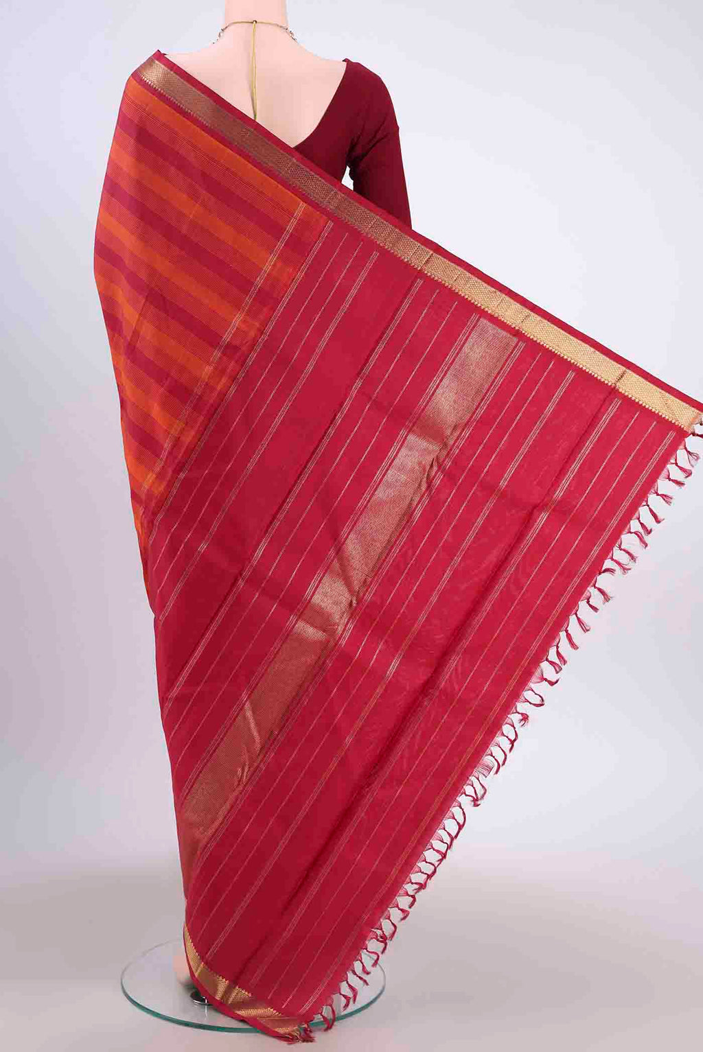 Flat view of Pure Silk Pure Zari Rust Kanchipuram Saree with Stripes on the body and Plain Border