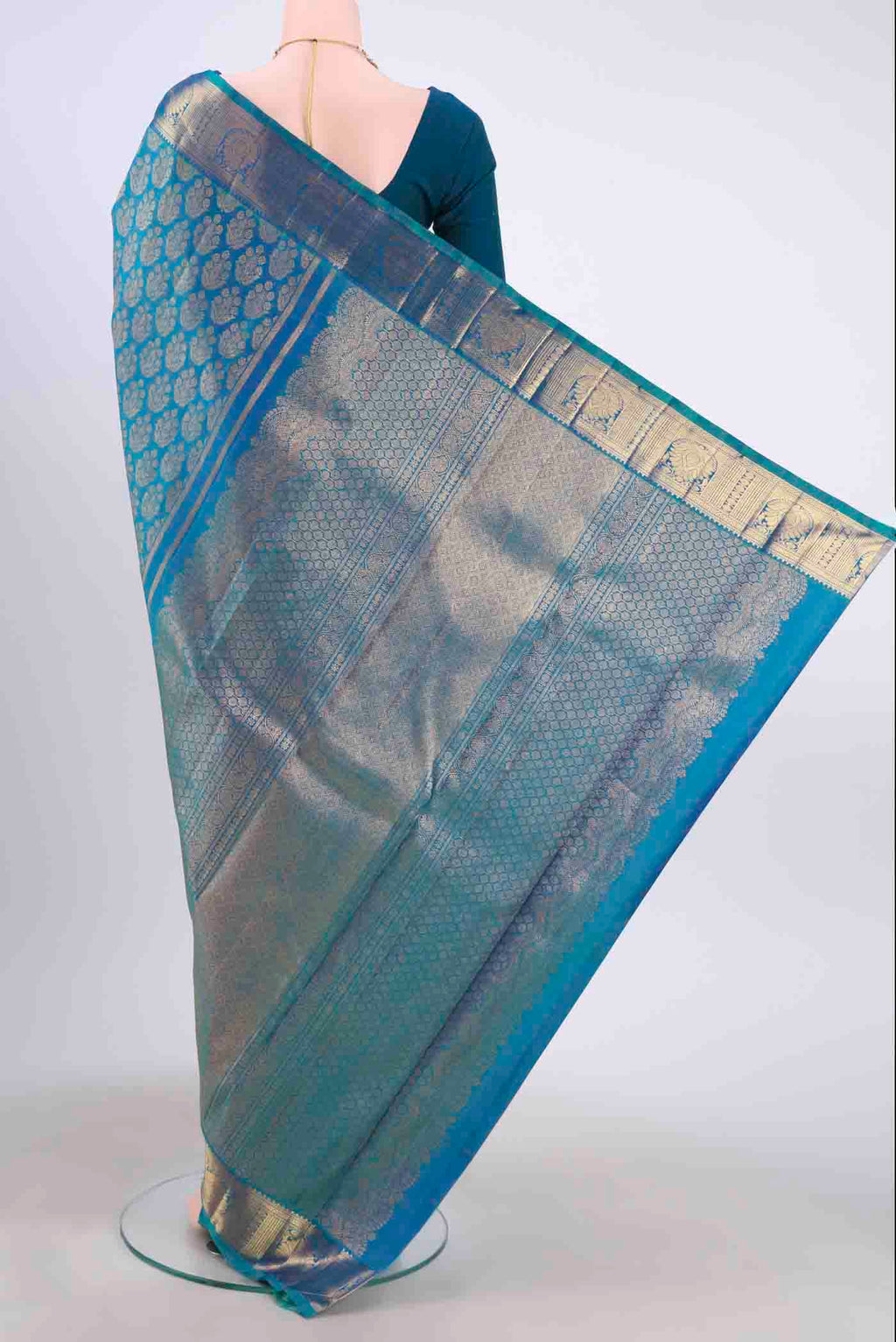 Flat view of Pure Silk Pure Zari Blue Kanchipuram Saree with Zari Brocade on the body and Zari Border