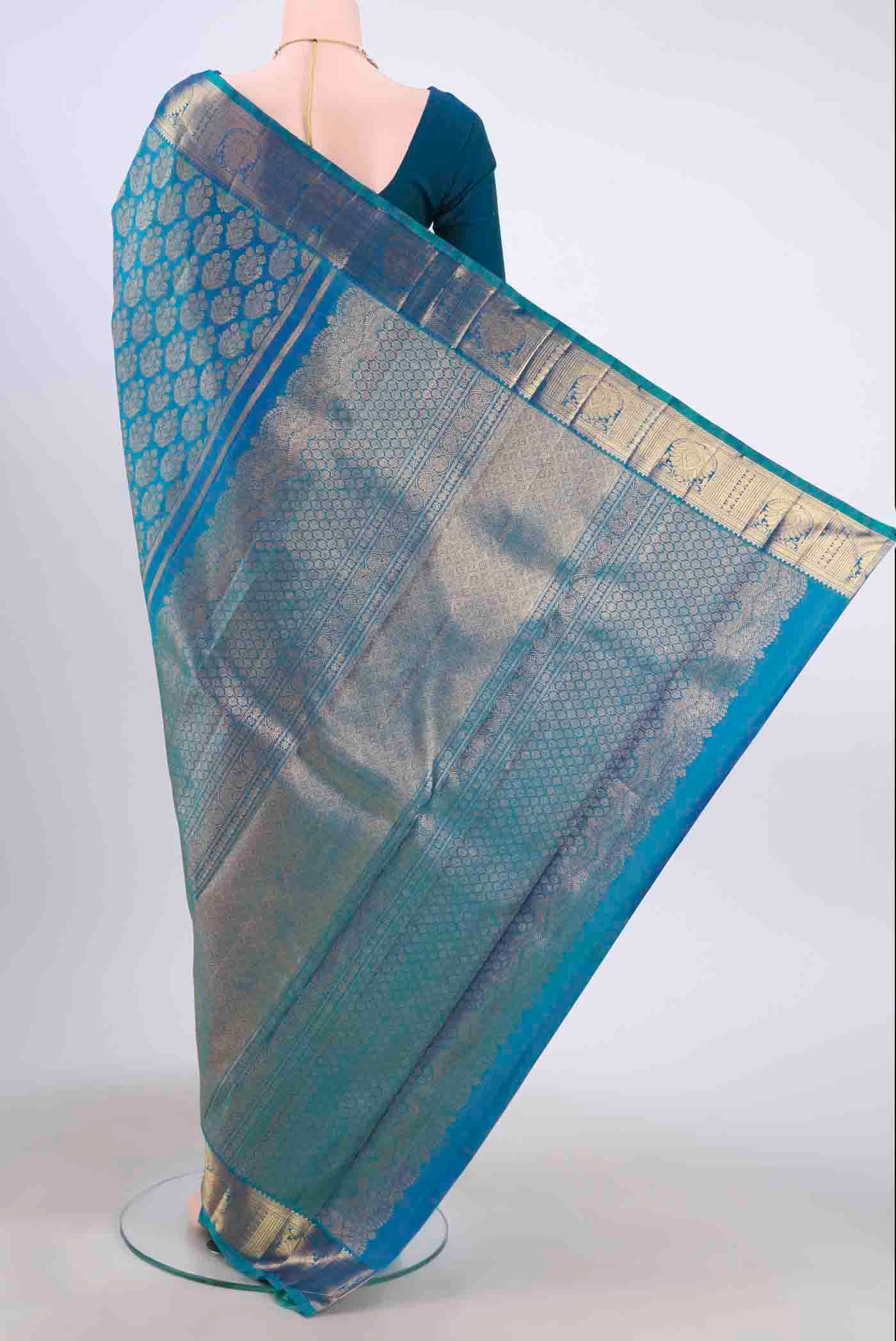 Flat view of Pure Silk Pure Zari Blue Kanchipuram Saree with Zari Brocade on the body and Zari Border