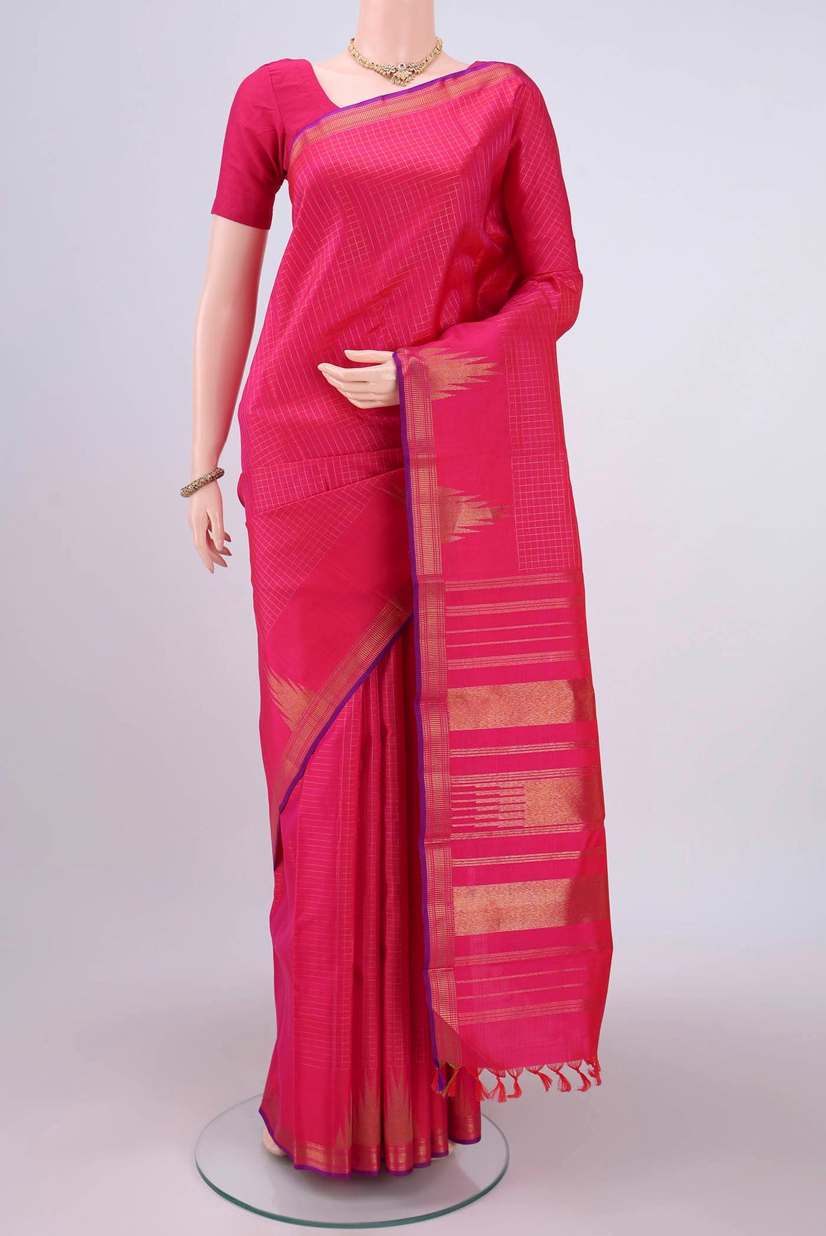 Pure Silk Pure Zari Dark Pink Kanchipuram Saree with Checked design on the body and Temple Border.  displayed on a mannequin
