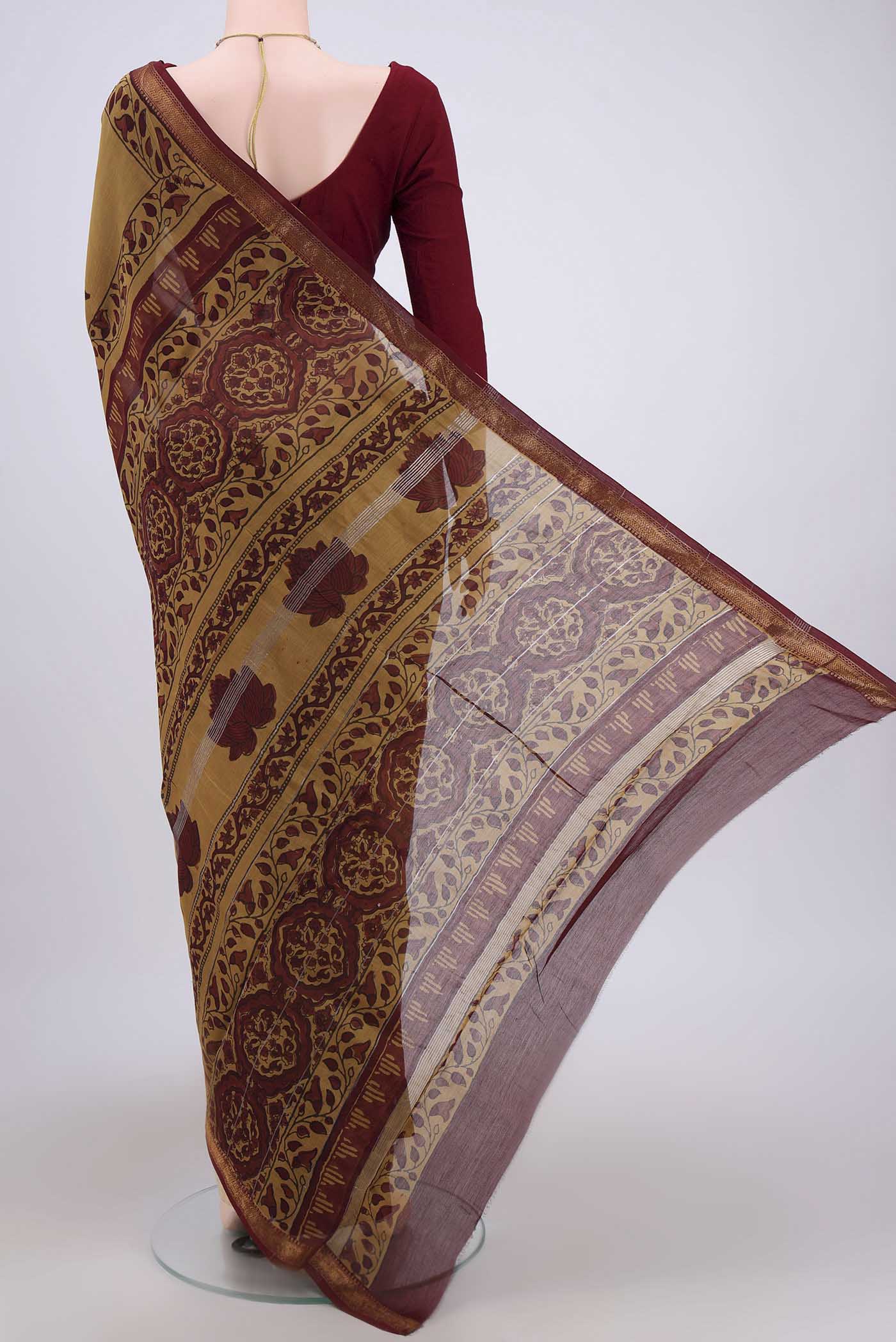 Flat view of Mustard Maheshwari Silk Cotton Saree with Printed design on the body and Zari Border. 