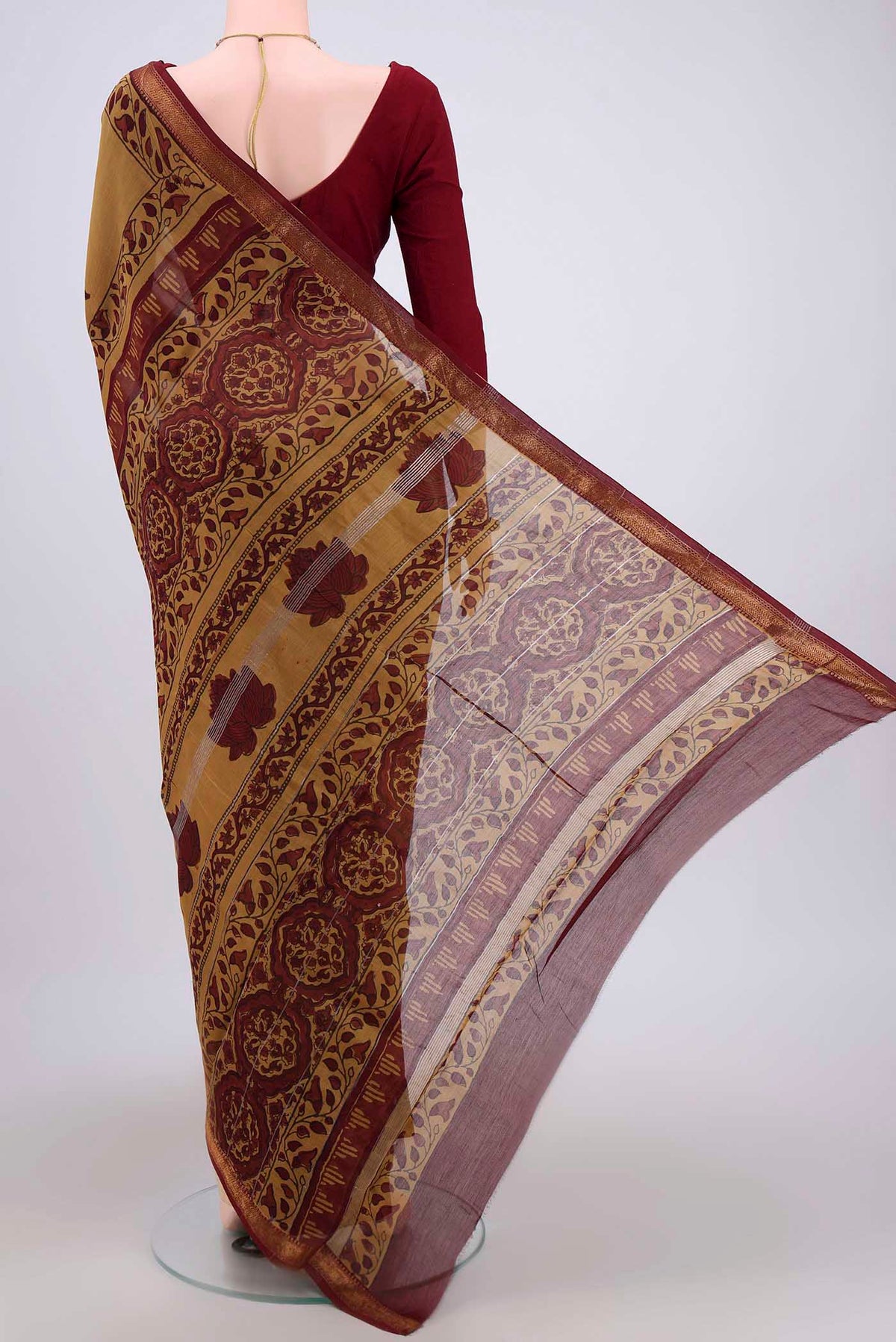 Flat view of Mustard Maheshwari Silk Cotton Saree with Printed design on the body and Zari Border. 