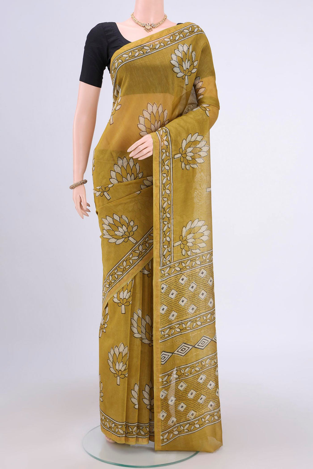 Mehandi Green Chanderi Silk Saree with Printed design on the body and Zari Border.  displayed on a mannequin
