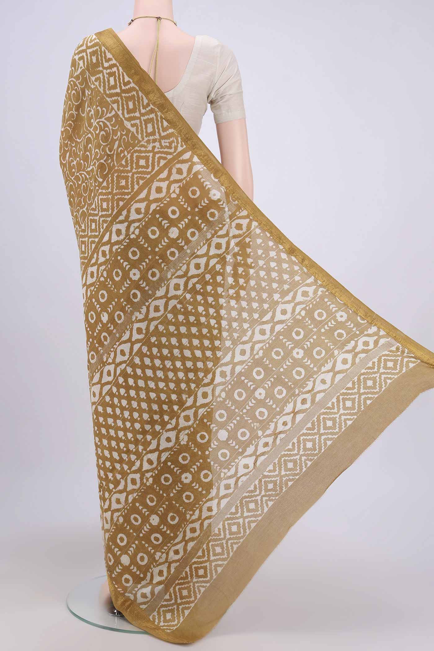 Flat view of Mustard Maheshwari Silk Cotton Saree with Printed design on the body and Zari Border. 